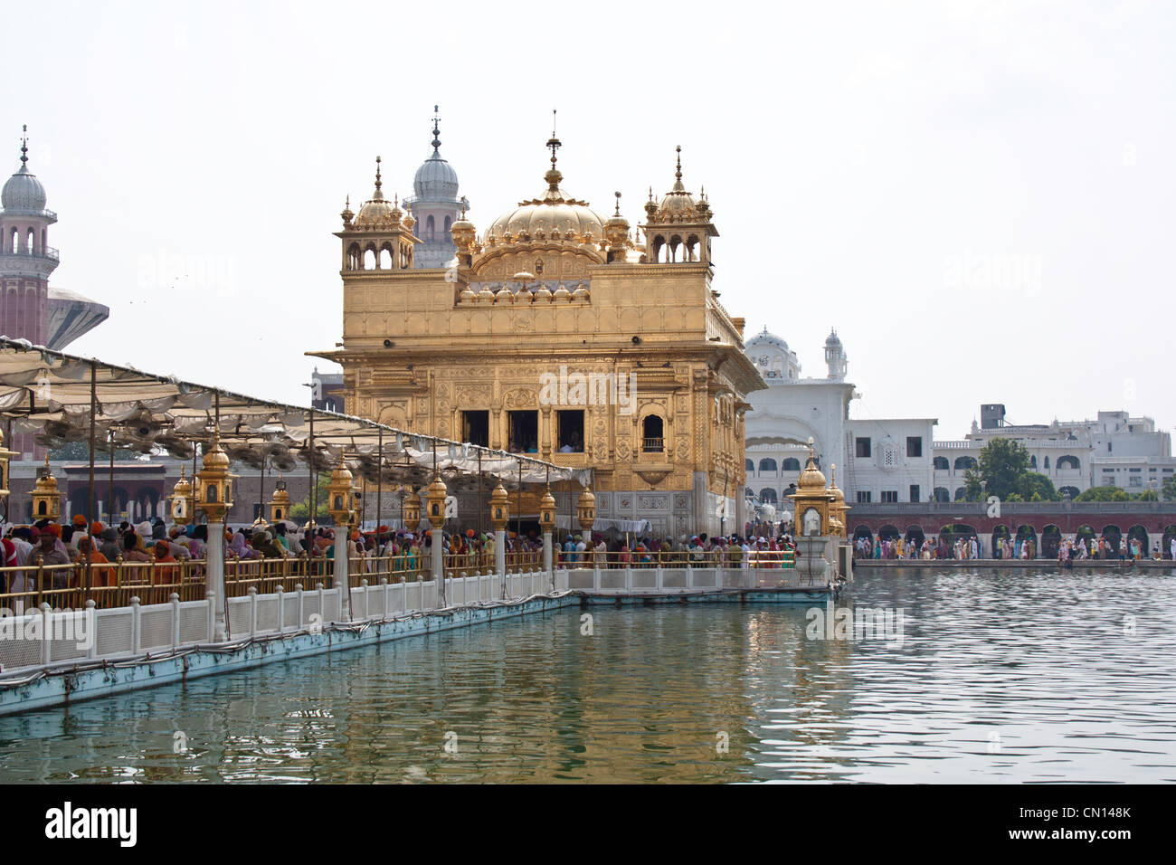 Causeway leading to the Golden Temple, the corridor crowded with devotees who wanted to go the Darbar Sahib and pray inside Stock Photo