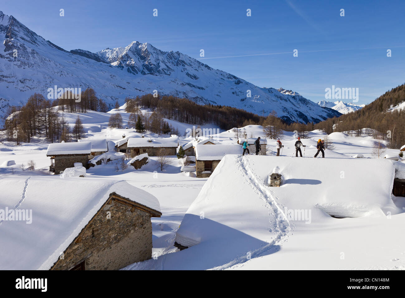 France, Savoie, Sainte Foy Tarentaise, gone hiking in rackets in the hamlet of high mountain pasture Le Monal Stock Photo
