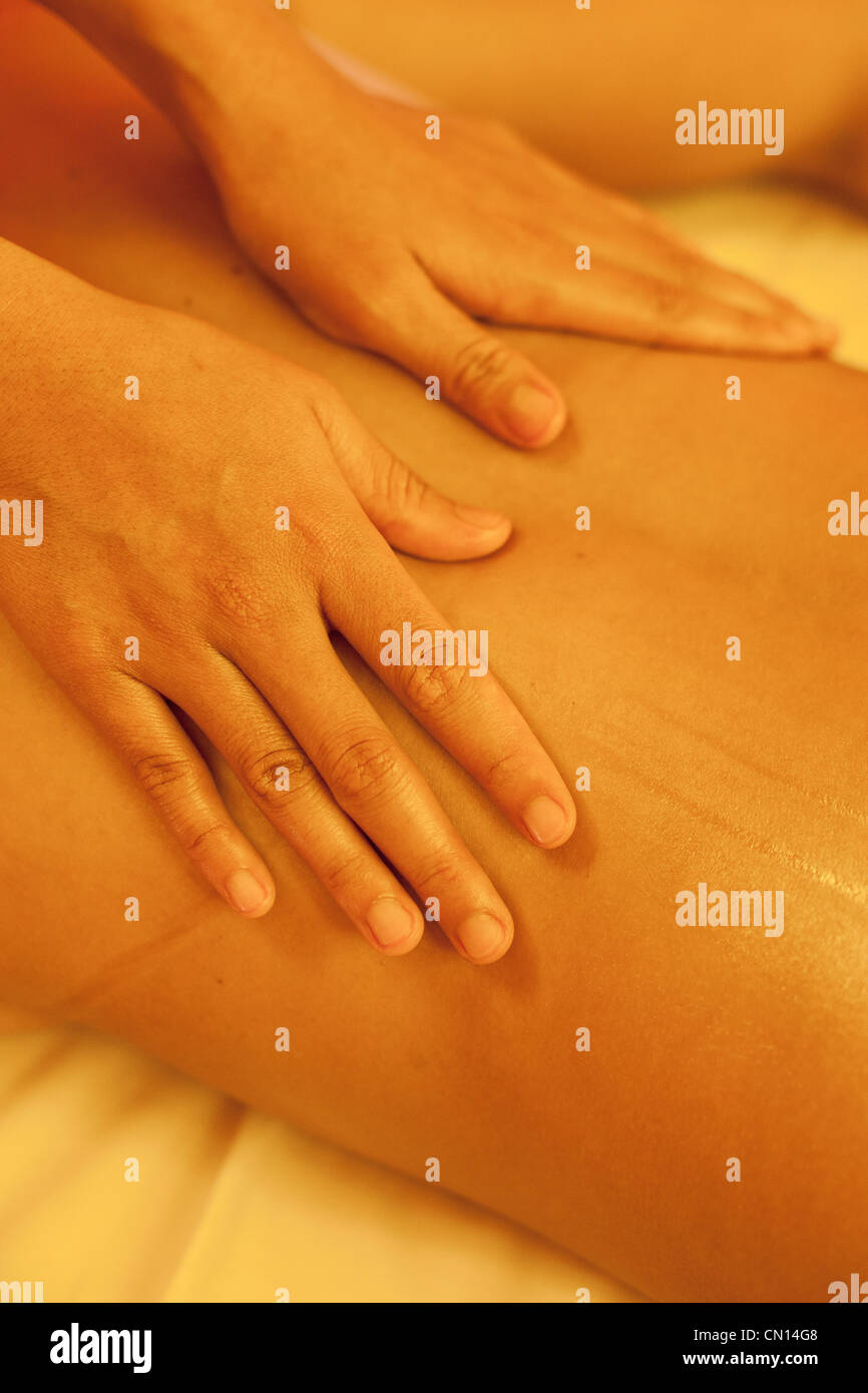 Hands on back Massaging. Bali Indonesia Stock Photo