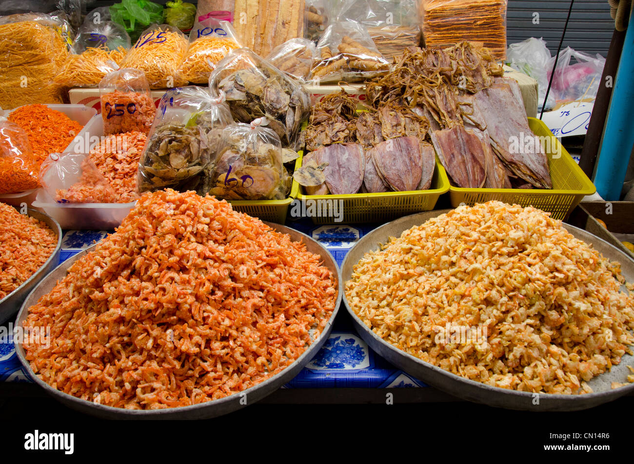Thailand, Bangkok. Maeklong railroad tracks market. Dried seafood