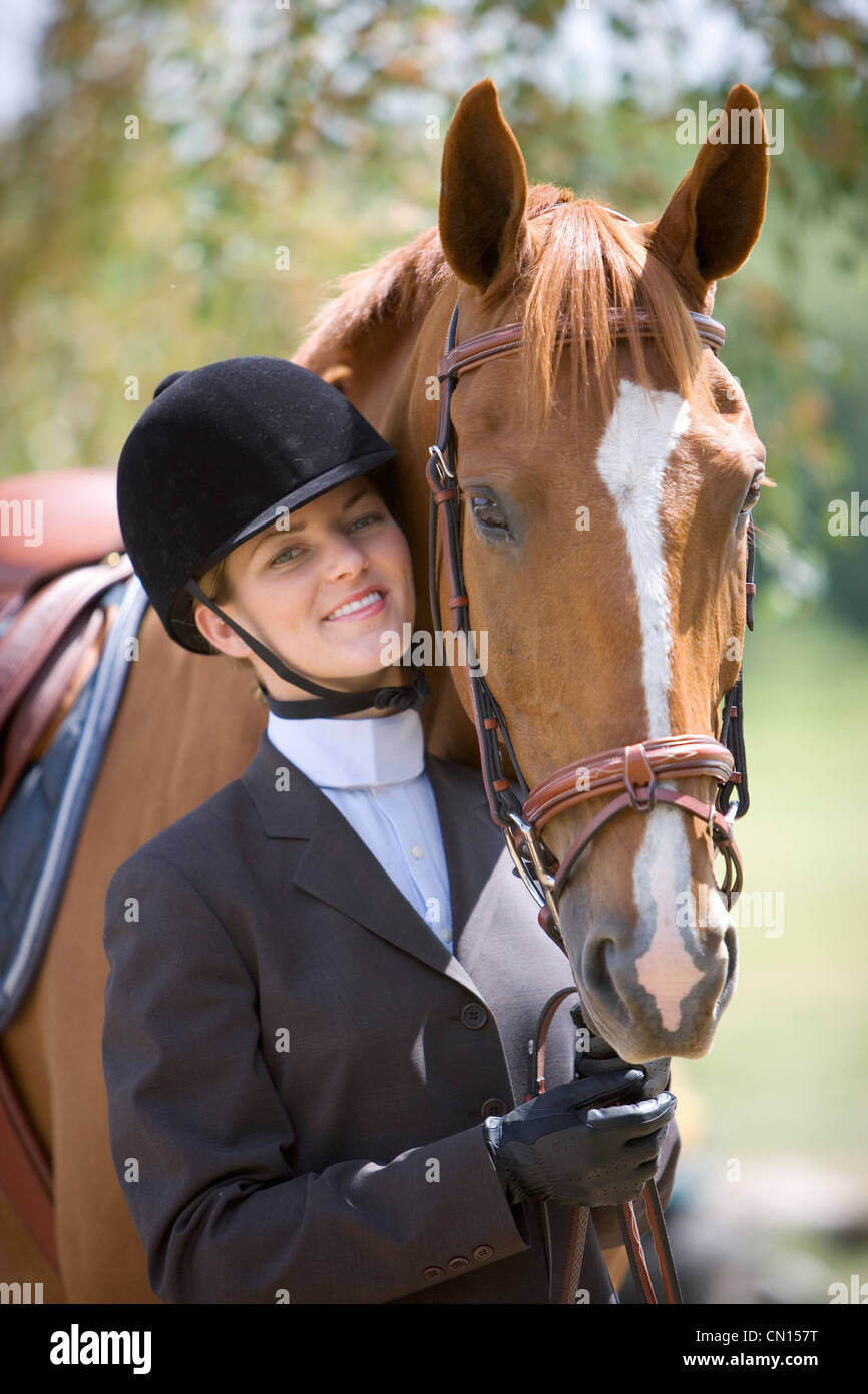 Young woman in riding gear with a horse, Cambridge, Ontario Stock Photo Alamy