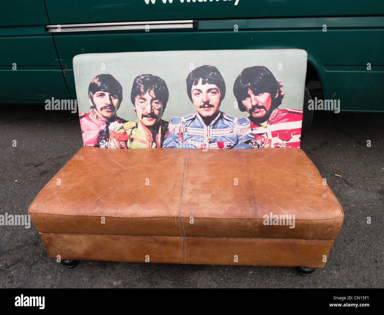 A sofa with back comrpising image of The Beatles in their Sgt Pepper days Stock Photo