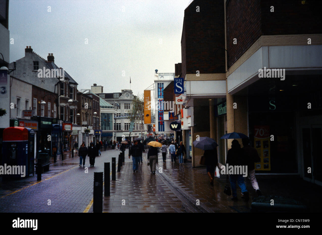 Surrey England Sutton High Street People Shopping In The Rain Stock Photo