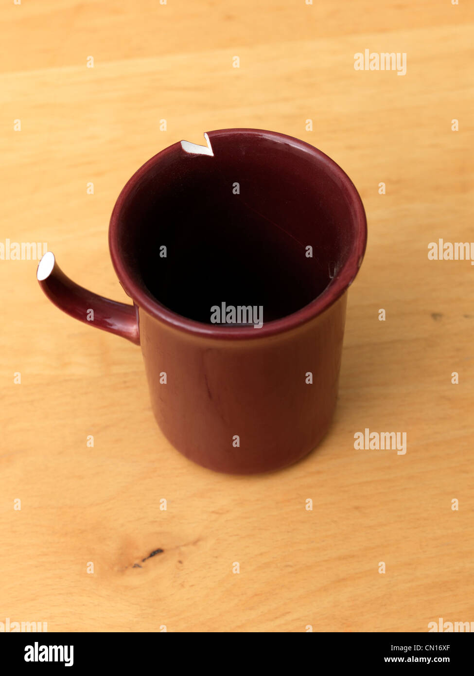 Red Mug Chipped On The Rim and Broken Handle Stock Photo Alamy