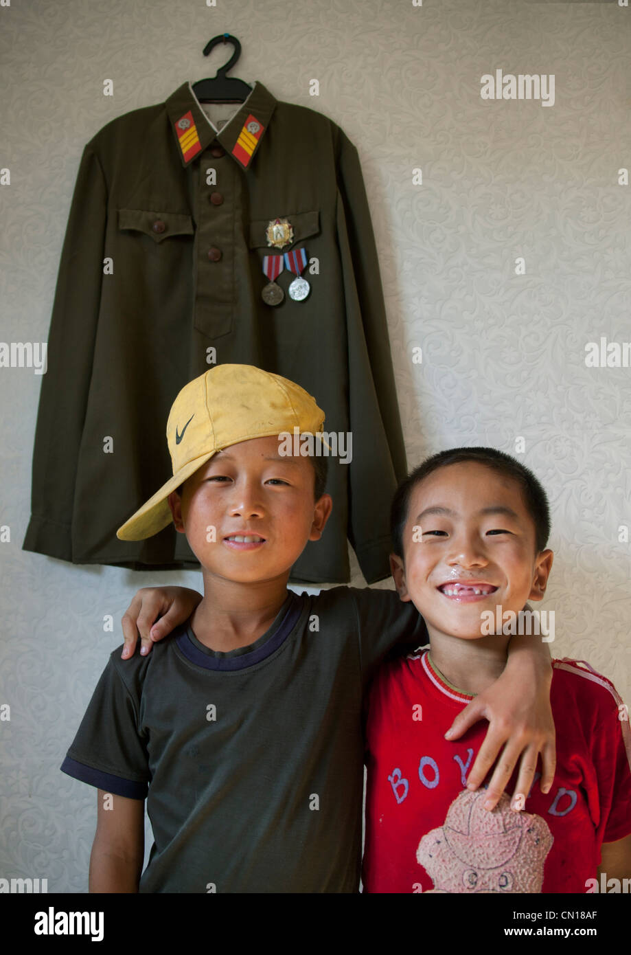 efficiëntie boezem Gehuurd North Korean kid with Nike cap posing in front of an army jacket, North  Korea Stock Photo - Alamy
