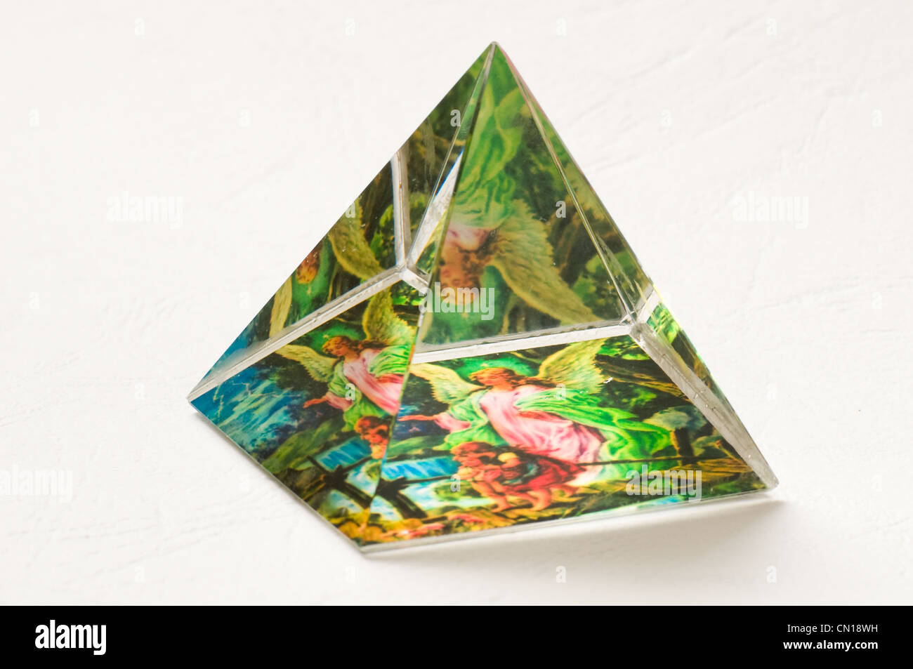 angel image in glass pyramind prism Stock Photo