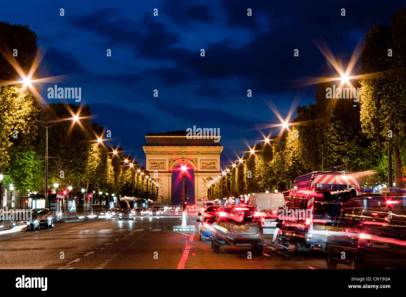 France, Paris, Champs Elysees and Arc de Triomphe dusk Stock Photo
