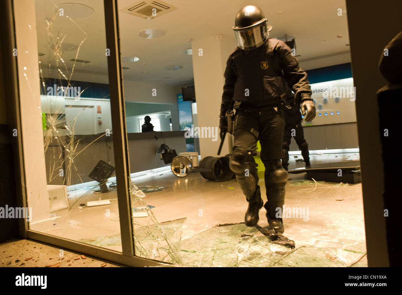 Riot police stormed out of a store during the general strike of 2010 in ...