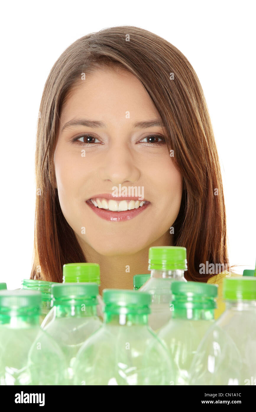 Young woman carrying a plastic container full with empty recyclable plastic. Recycling concept Stock Photo