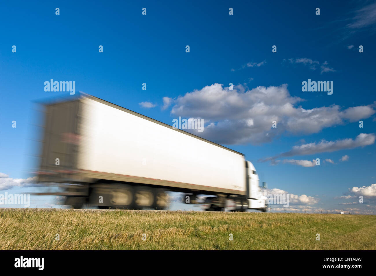 Moving transport truck on Trans-Canada Highway, near Winnipeg, Manitoba Stock Photo