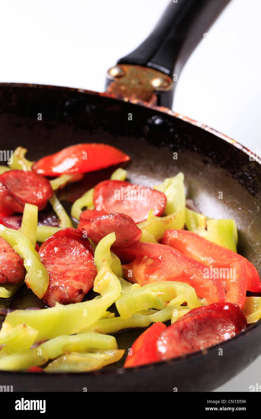 Preparing sausage and vegetable stir fry - detail Stock Photo - Alamy