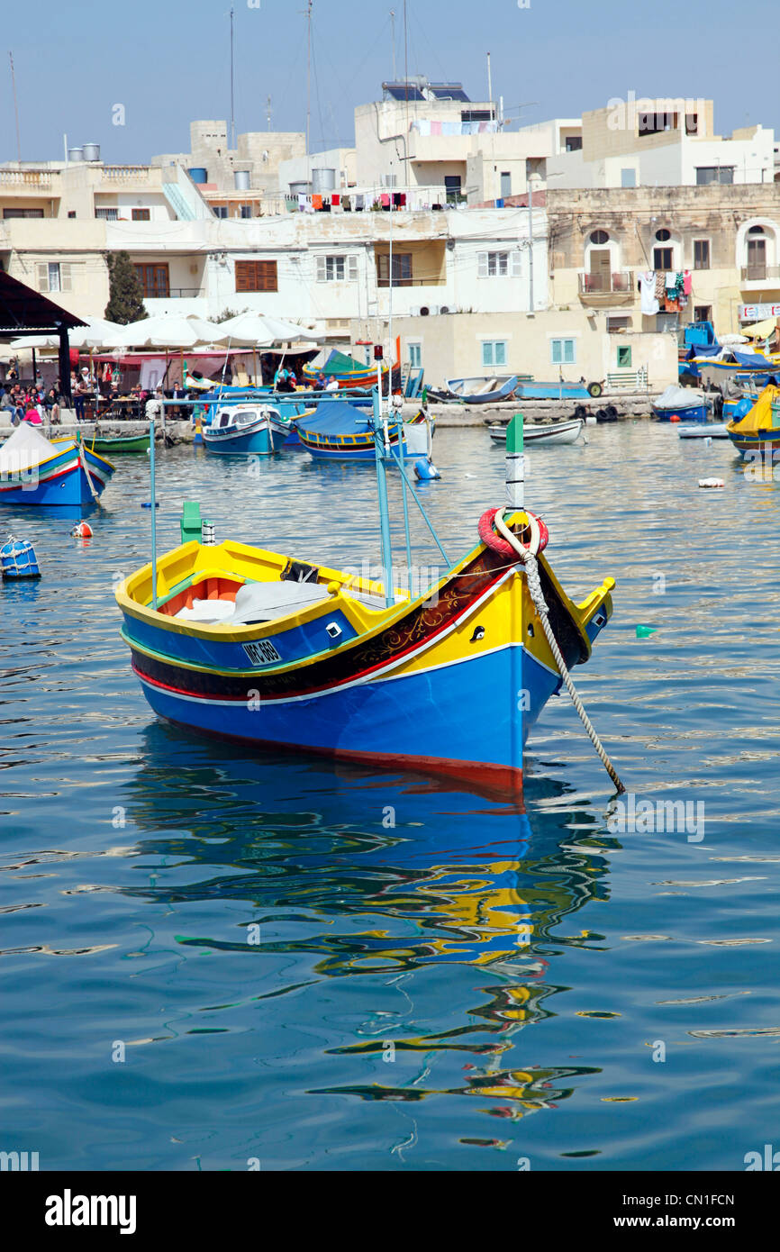 Traditional Maltese fishing boats known as dghajsa in the harbour at