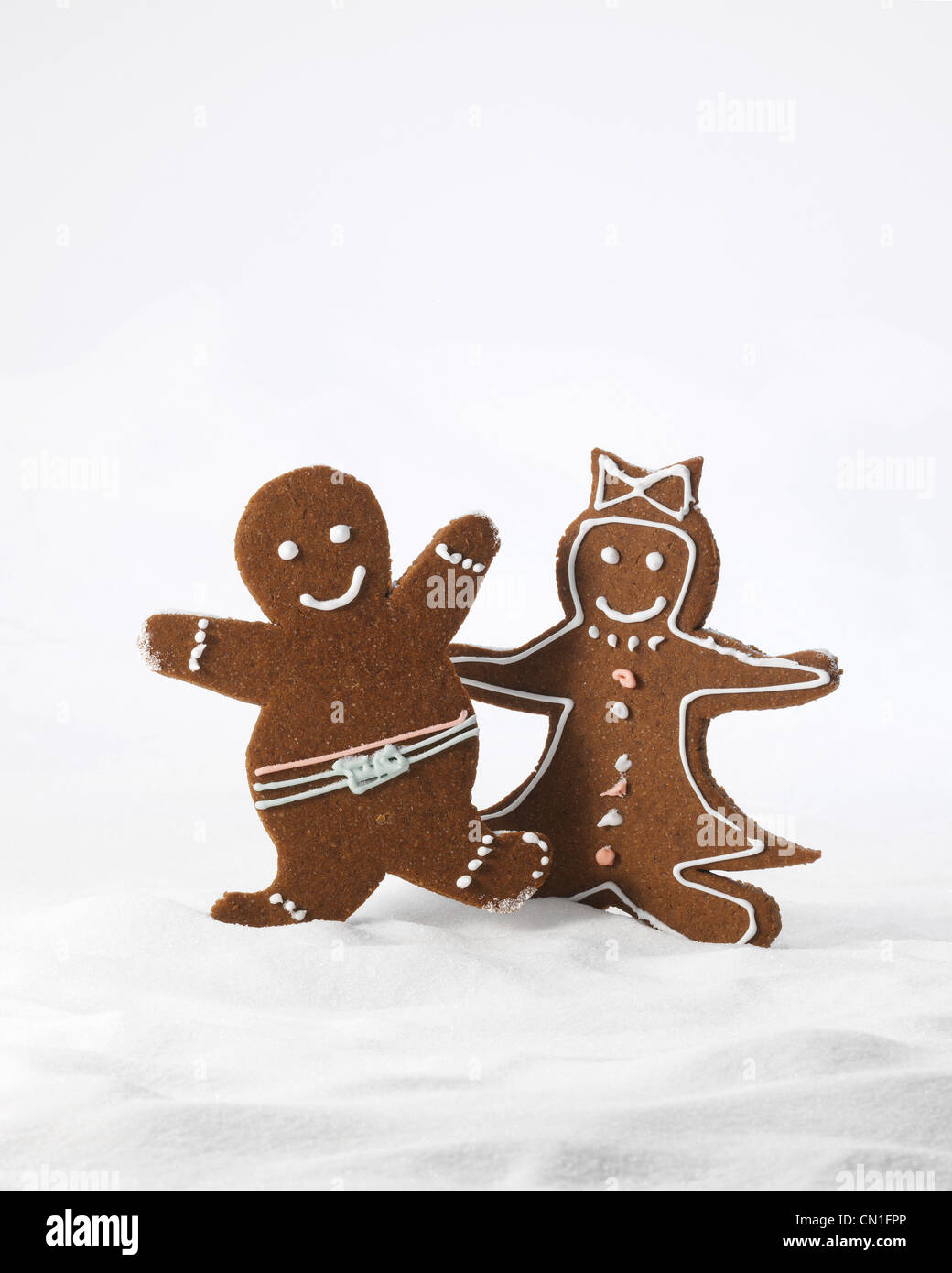 Gingerbread Couple Standing in Snow Stock Photo