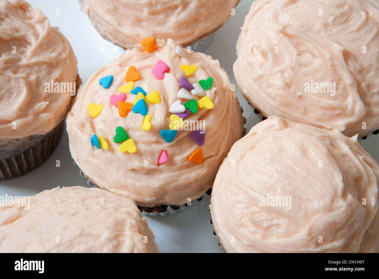 Cupcakes With Frosting and Sprinkles Stock Photo