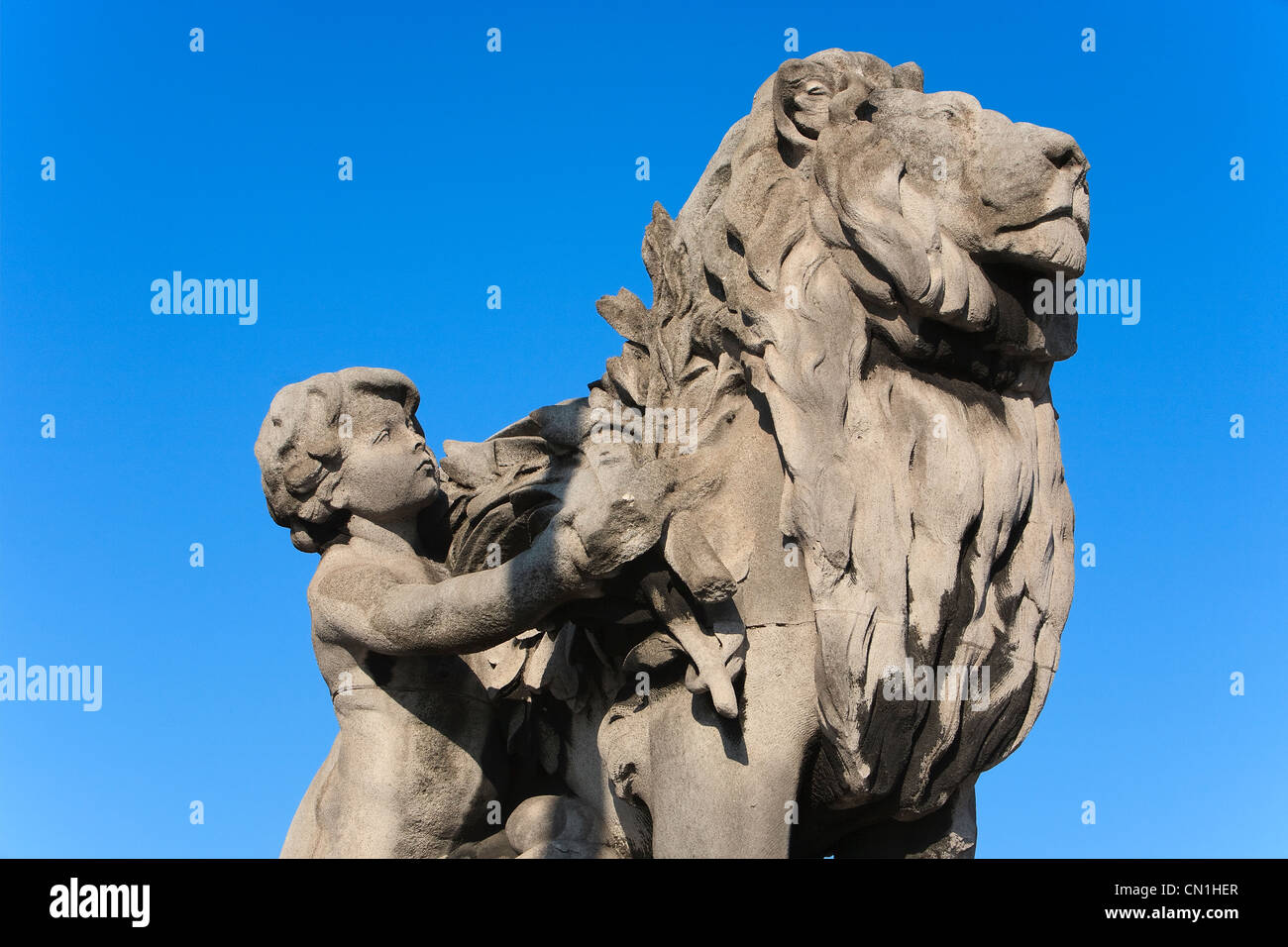 France, Paris, pont Alexandre III, statue by Jules Dalou Lion conduit par un enfant Stock Photo