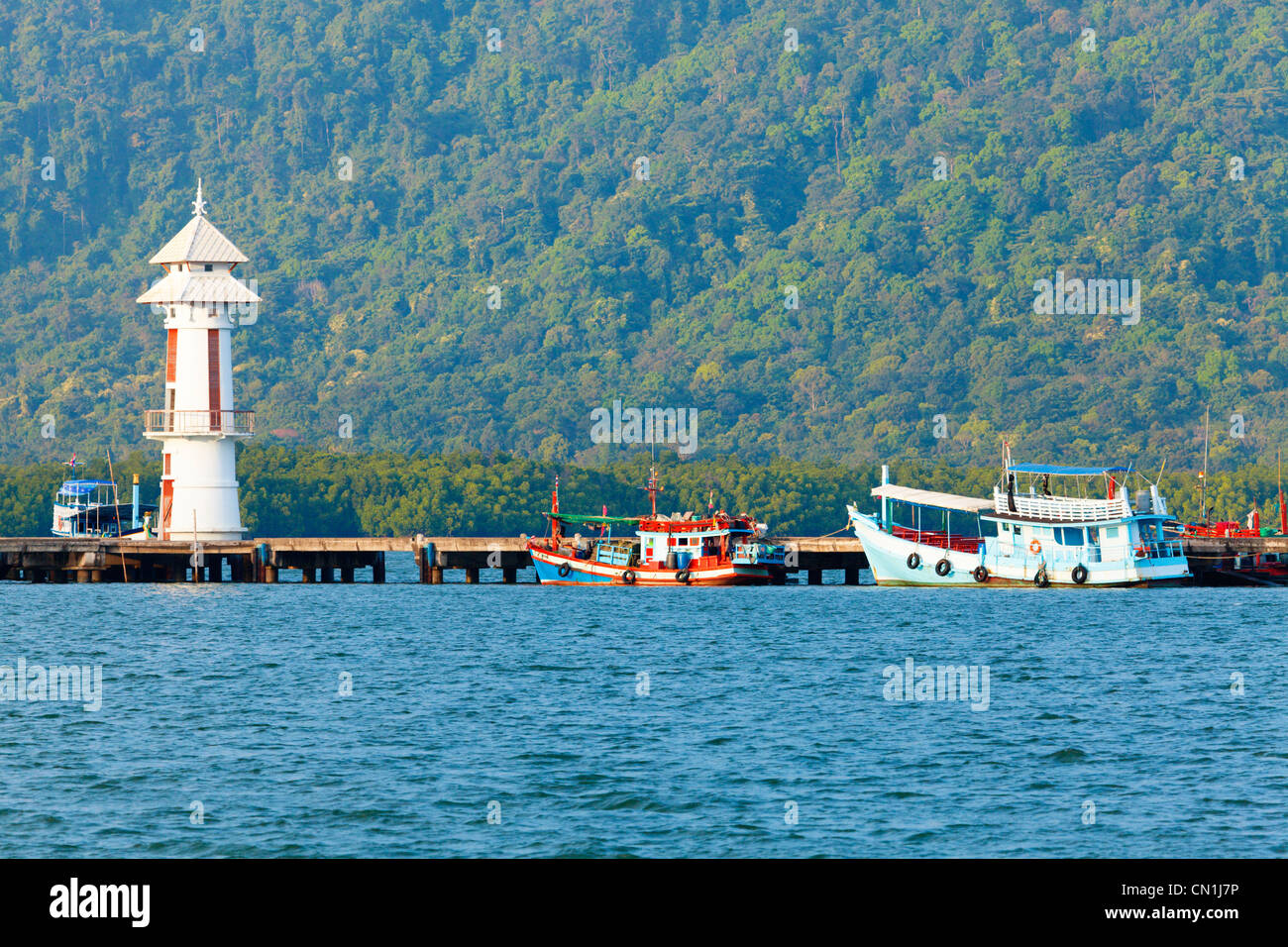Lighthouse on a pier Stock Photo