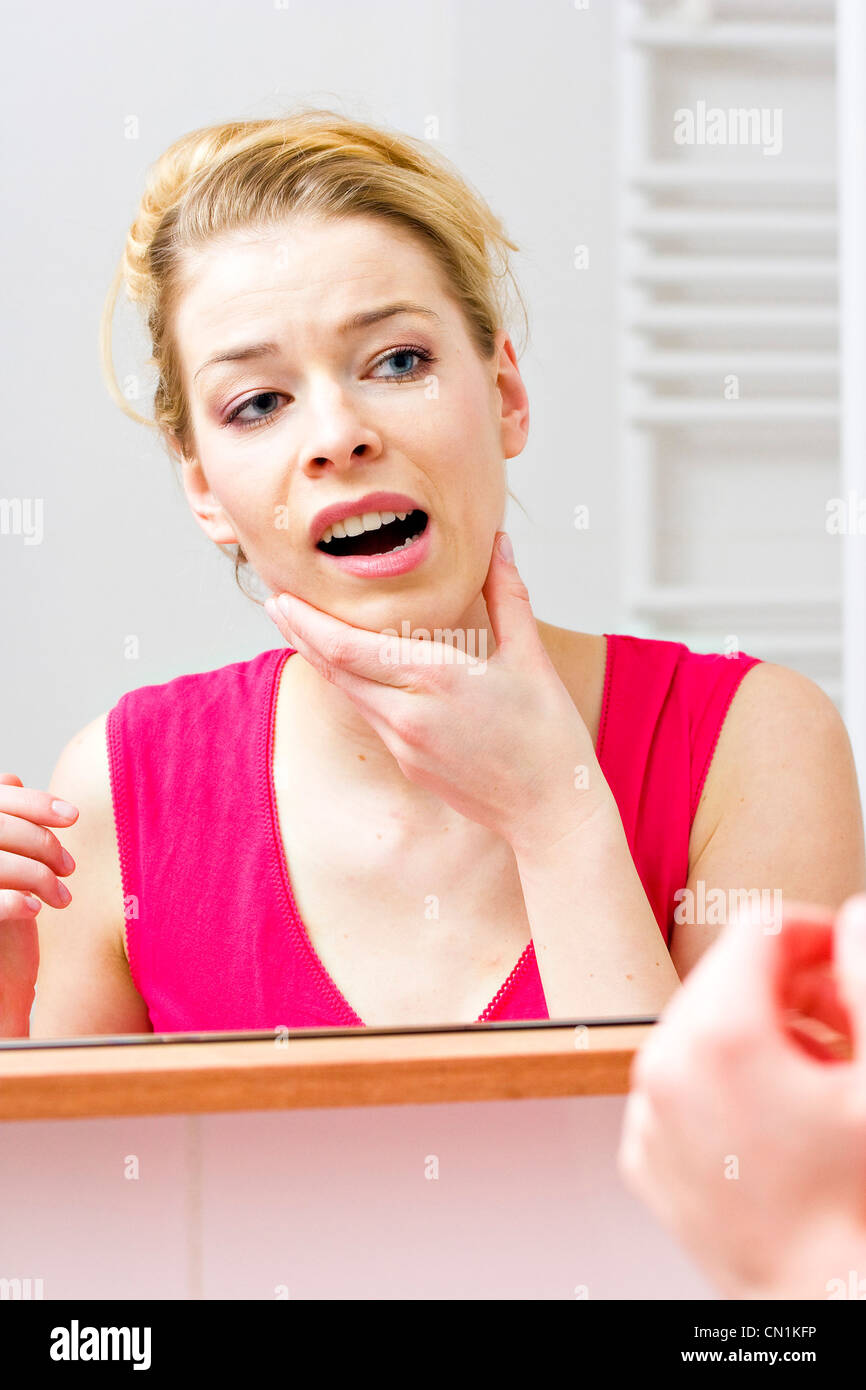Woman suffering from pains in the jaw Stock Photo