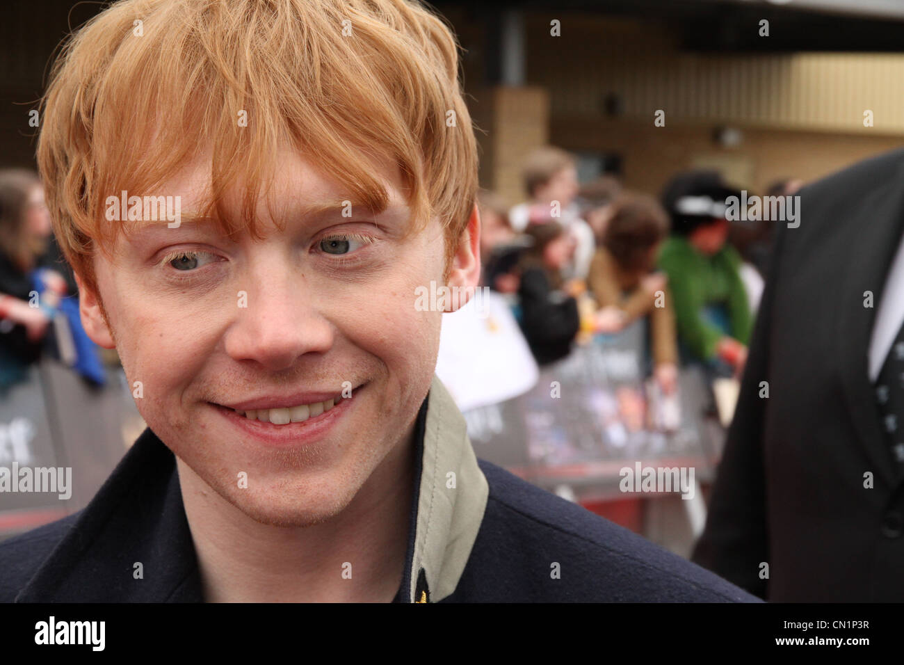 Harry Potter actor Rupert Grint (Ron Weasley) greets the crowd, at the Grand Opening of the Harry Potter Studio Tour Stock Photo