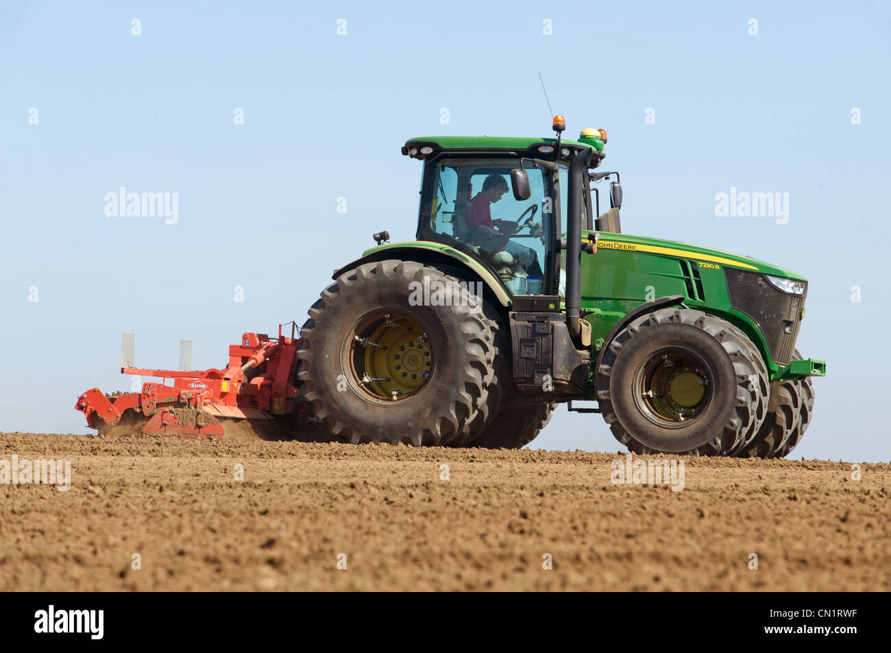 John Deere 7230R tractor fitted with Firestone Titan radial double