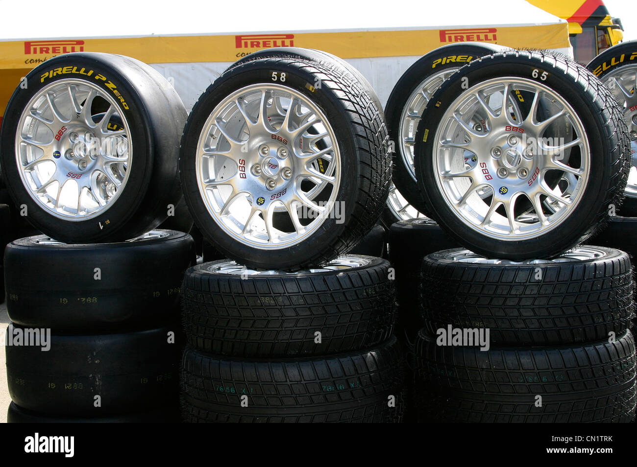 Racing wheels and tyres stacked in the paddock ready for use Stock ...
