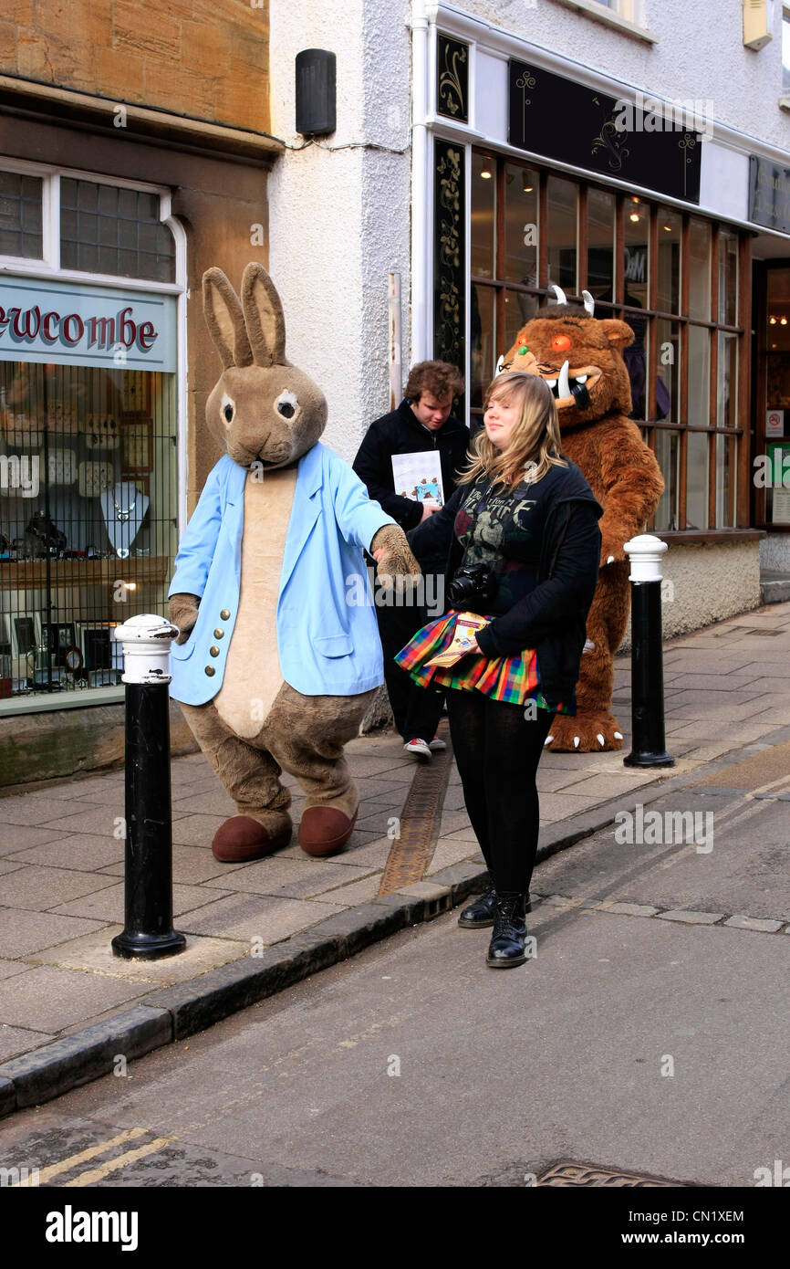 Peter Rabbit and the Gruffalo with friends out and about in an English town Stock Photo