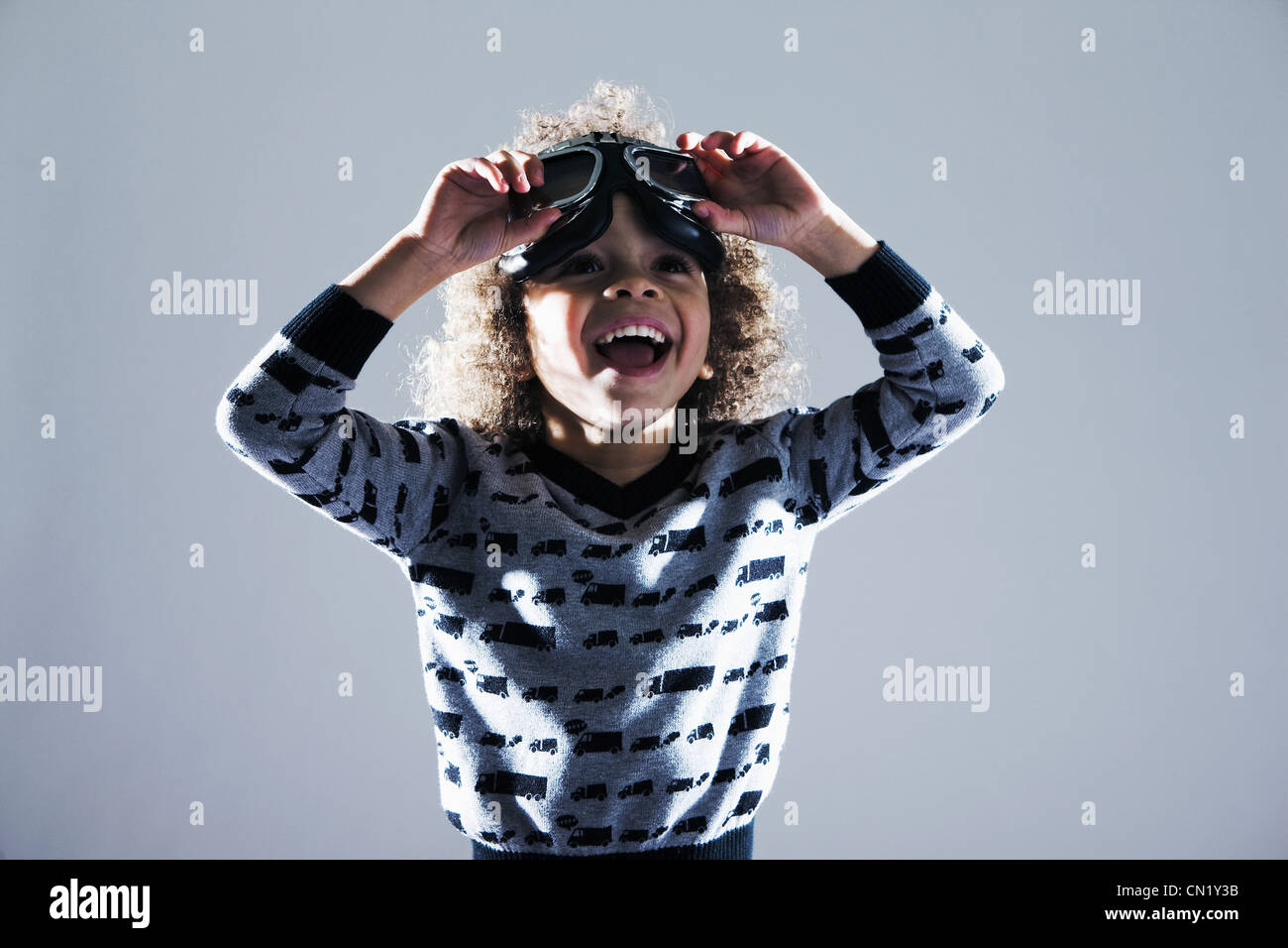 Young boy with flying goggles on head Stock Photo