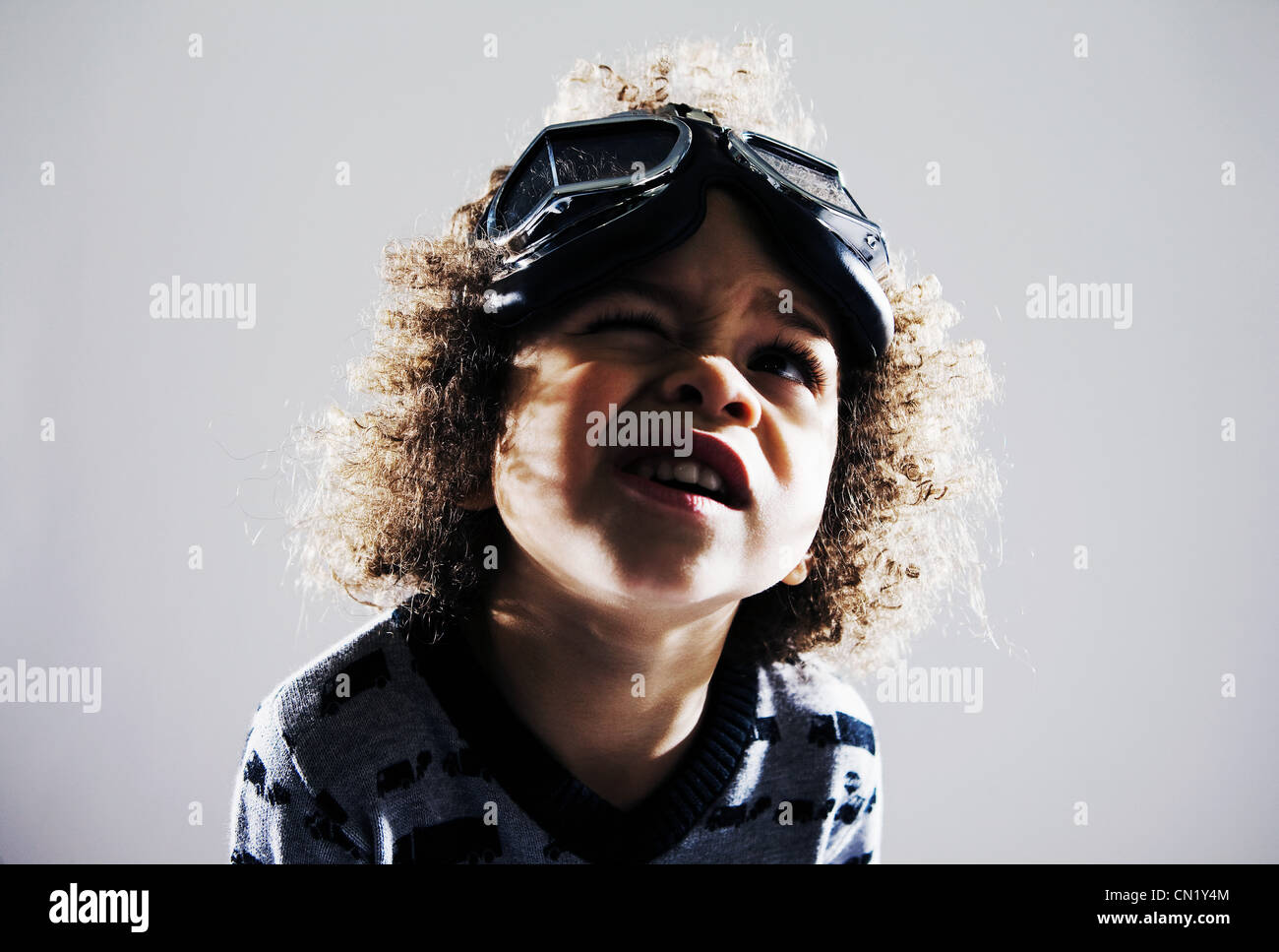Young boy with flying goggles on head Stock Photo