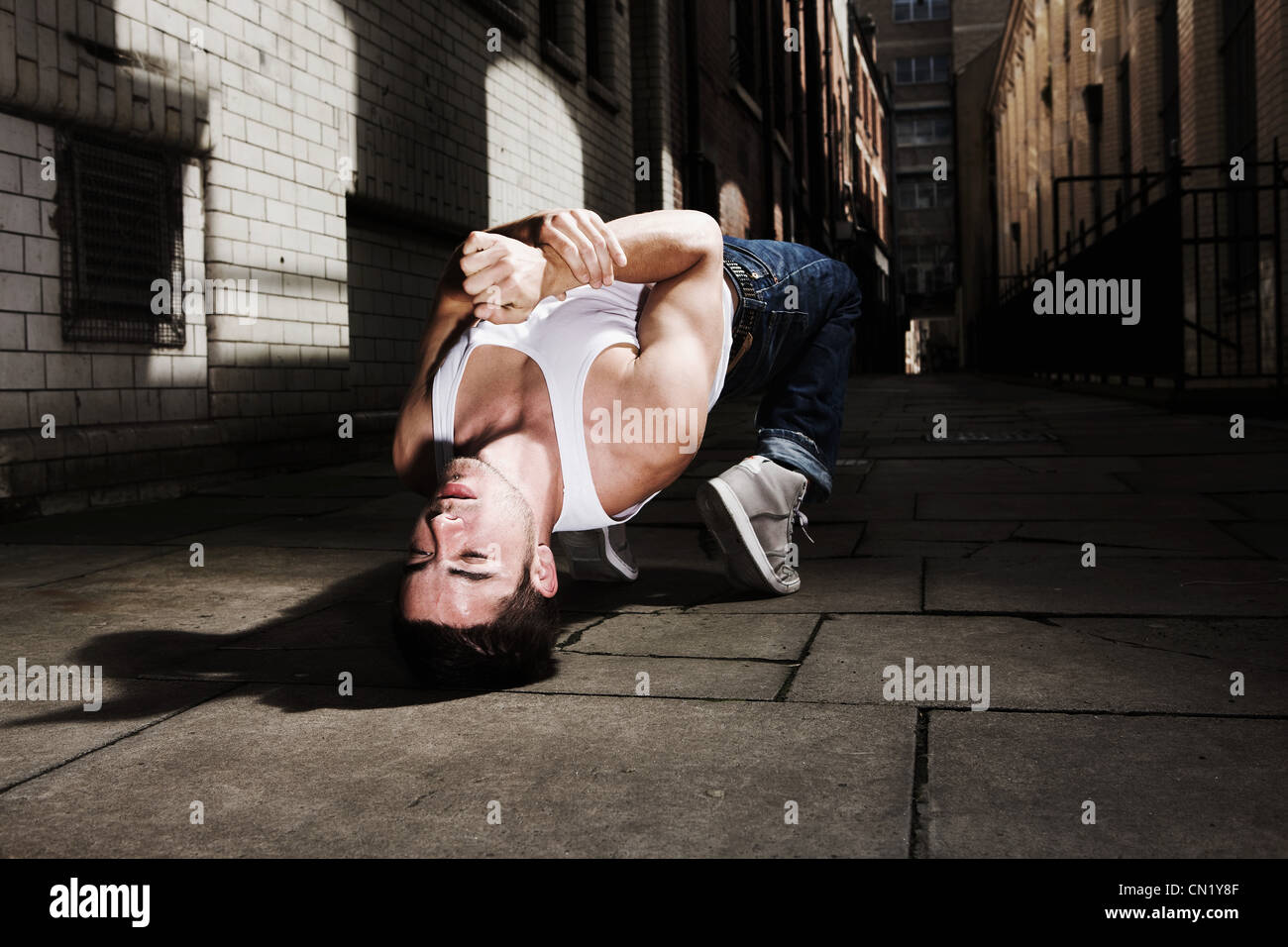 Young man breakdancing Stock Photo