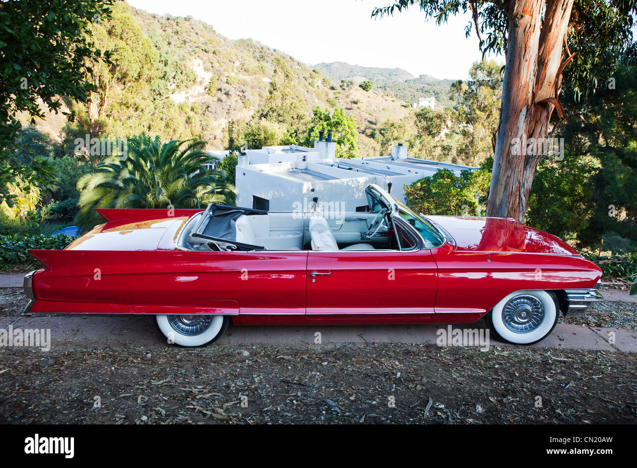 A classic red Cadillac parked outside in LA Stock Photo