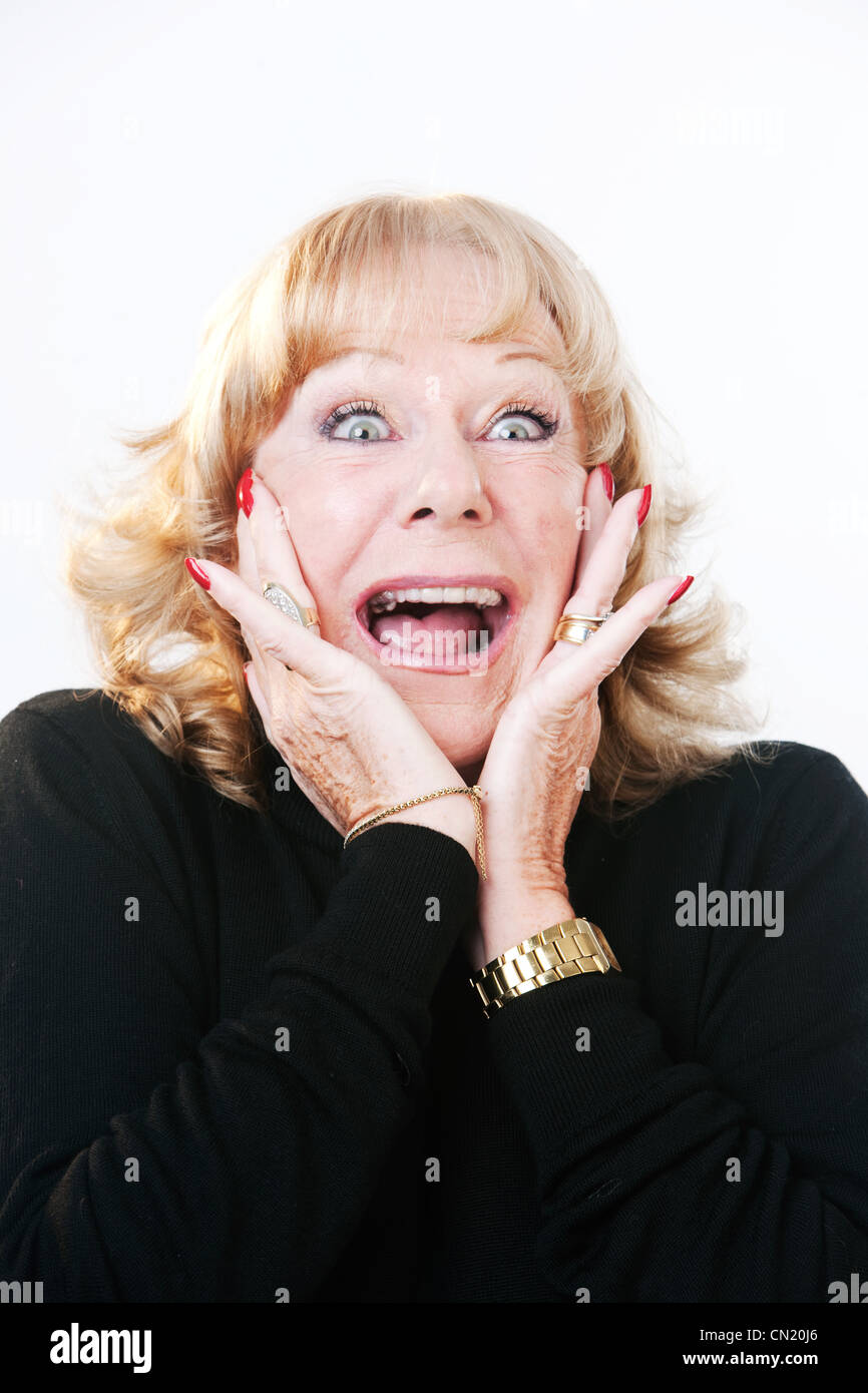Surprised mature woman Stock Photo