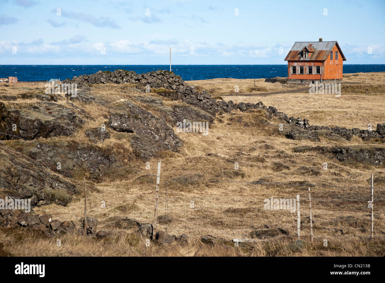 Iceland - Derelict house on headland, Iceland Stock Photo