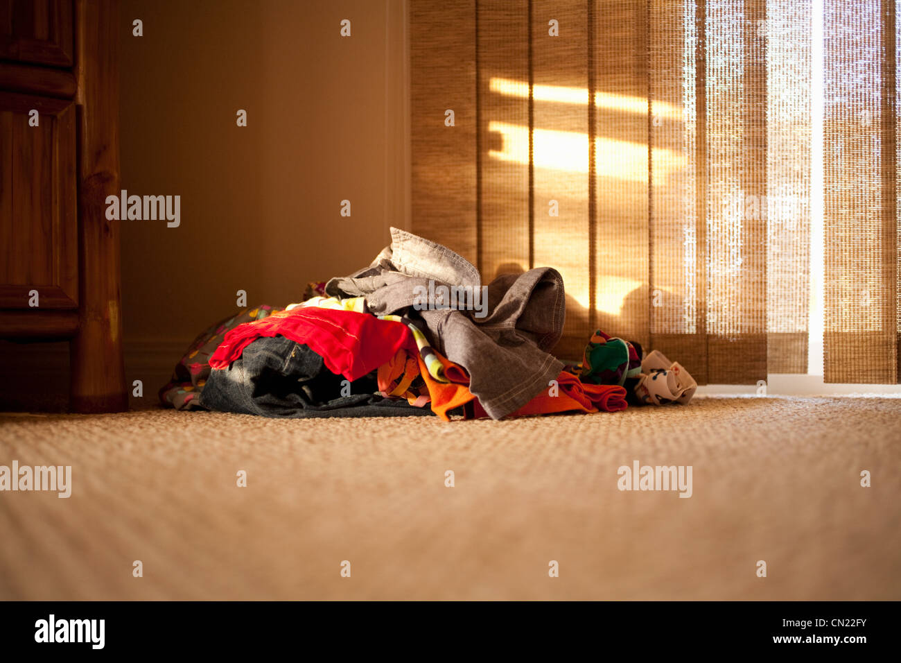 Pile of clothes on floor Stock Photo