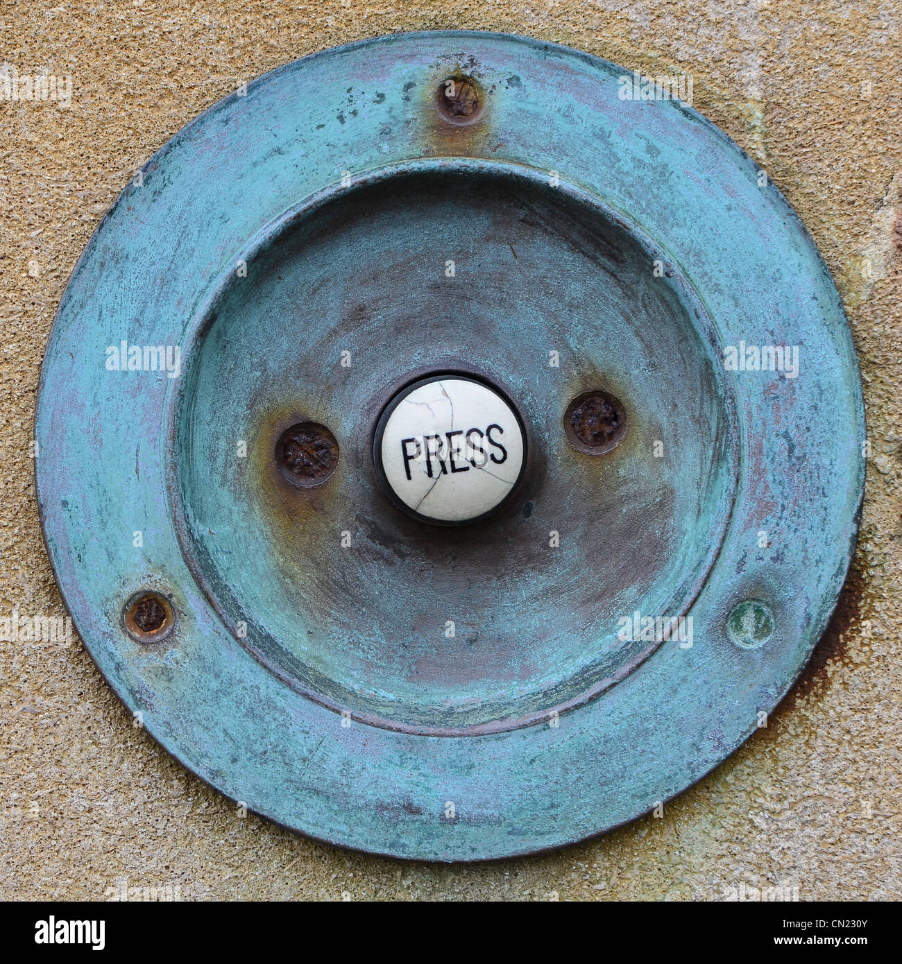 Victorian door bell button showing corrosion Stock Photo