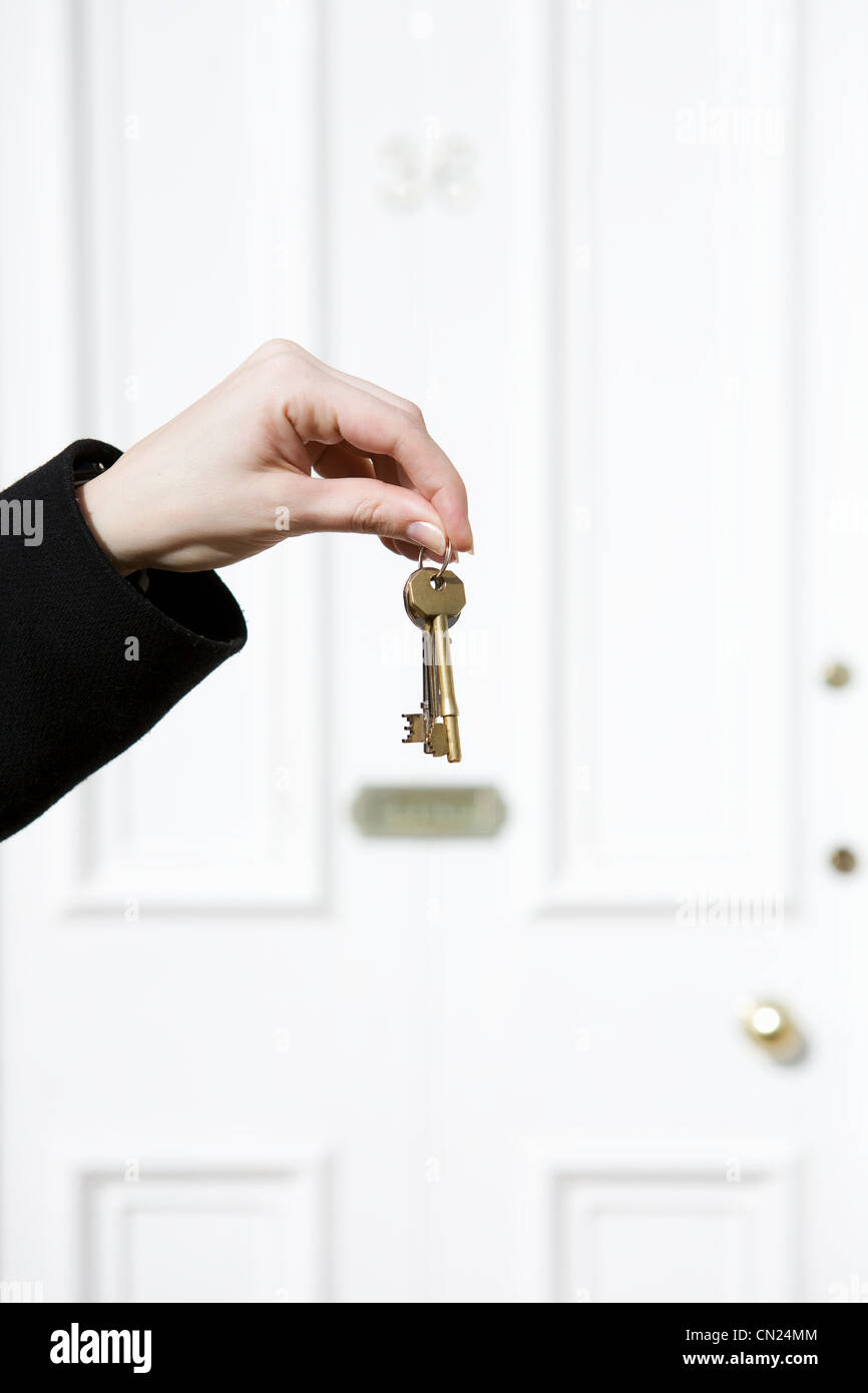 Woman holding house keys Stock Photo