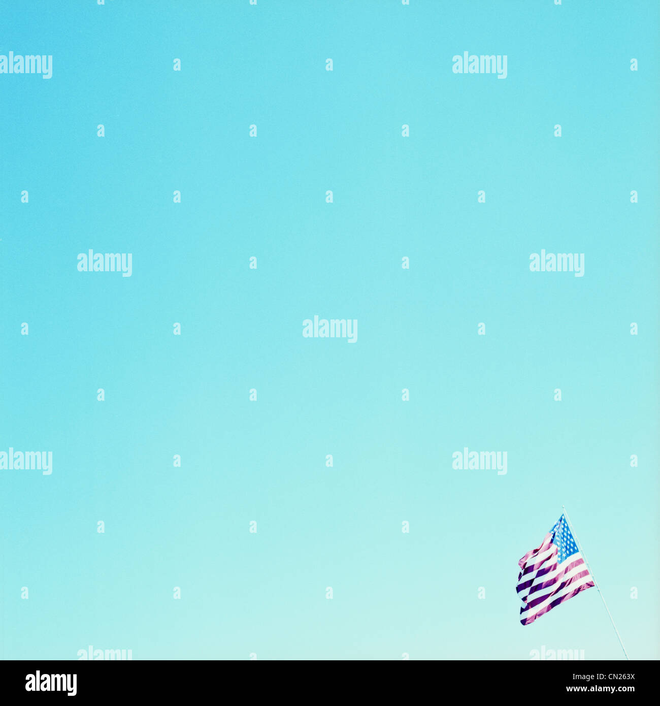 US flag against blue sky Stock Photo - Alamy
