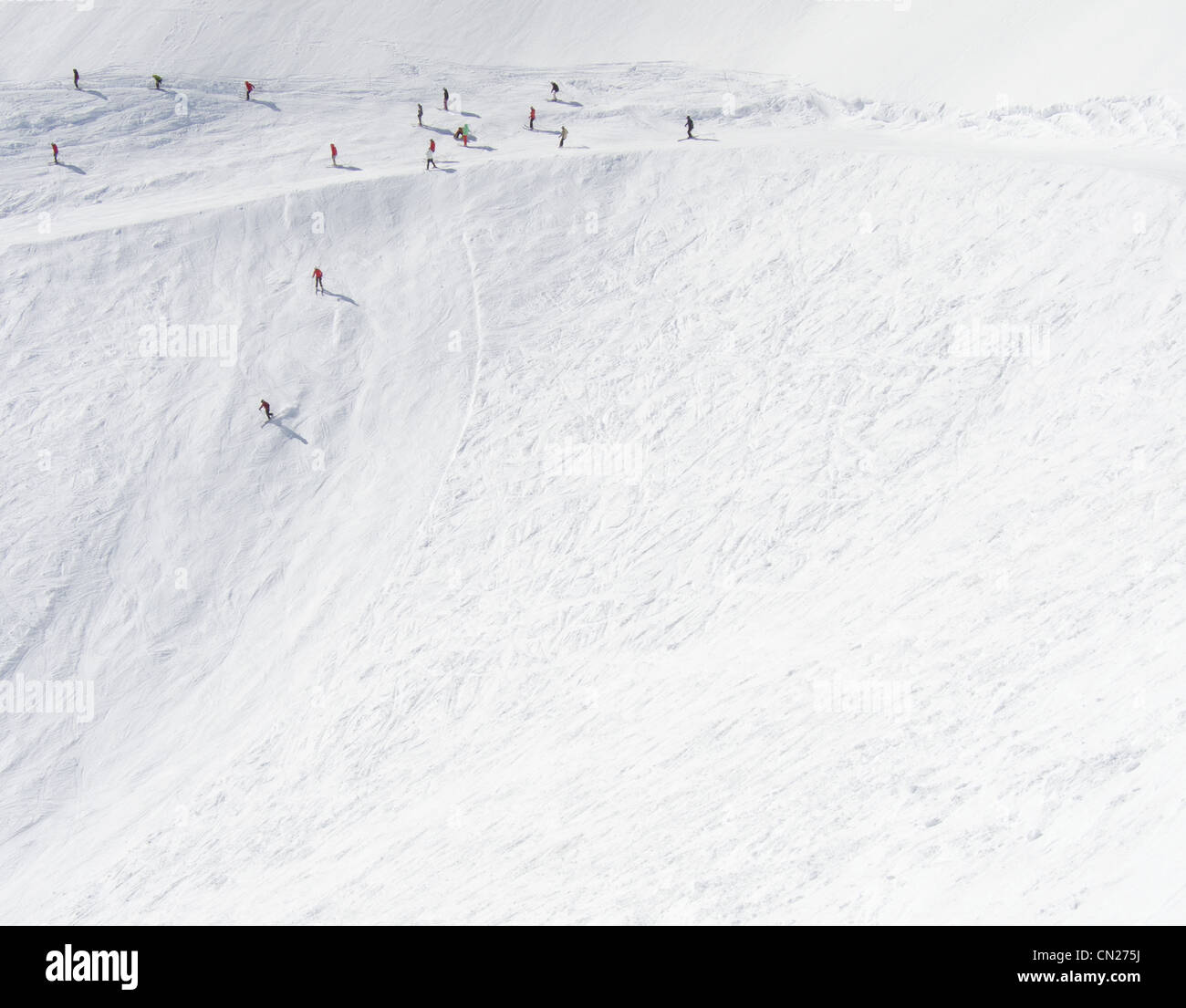 Skiers going down steep mountain side, Utah, USA Stock Photo
