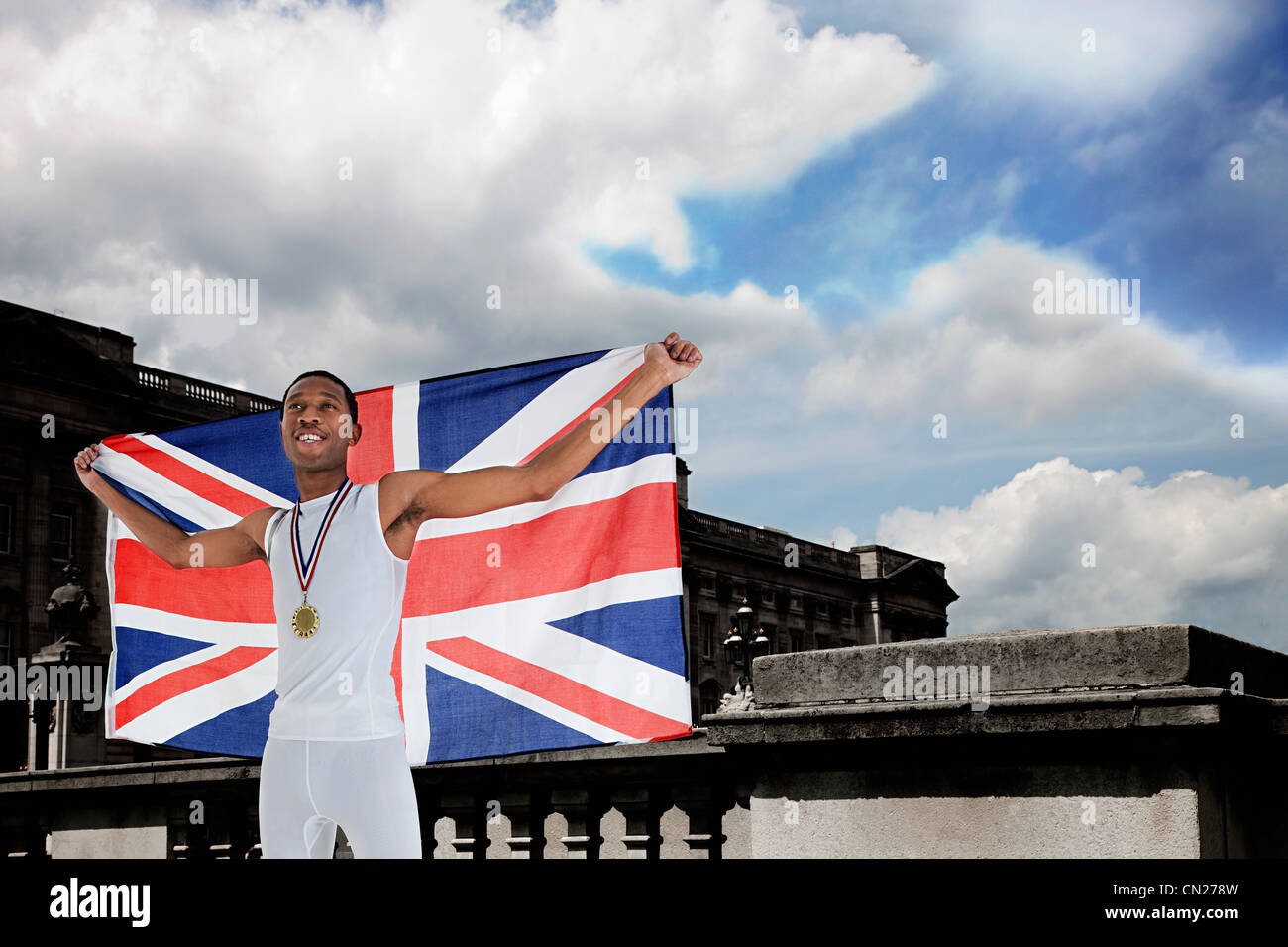 Olympic gold medal winner with Union Jack Stock Photo