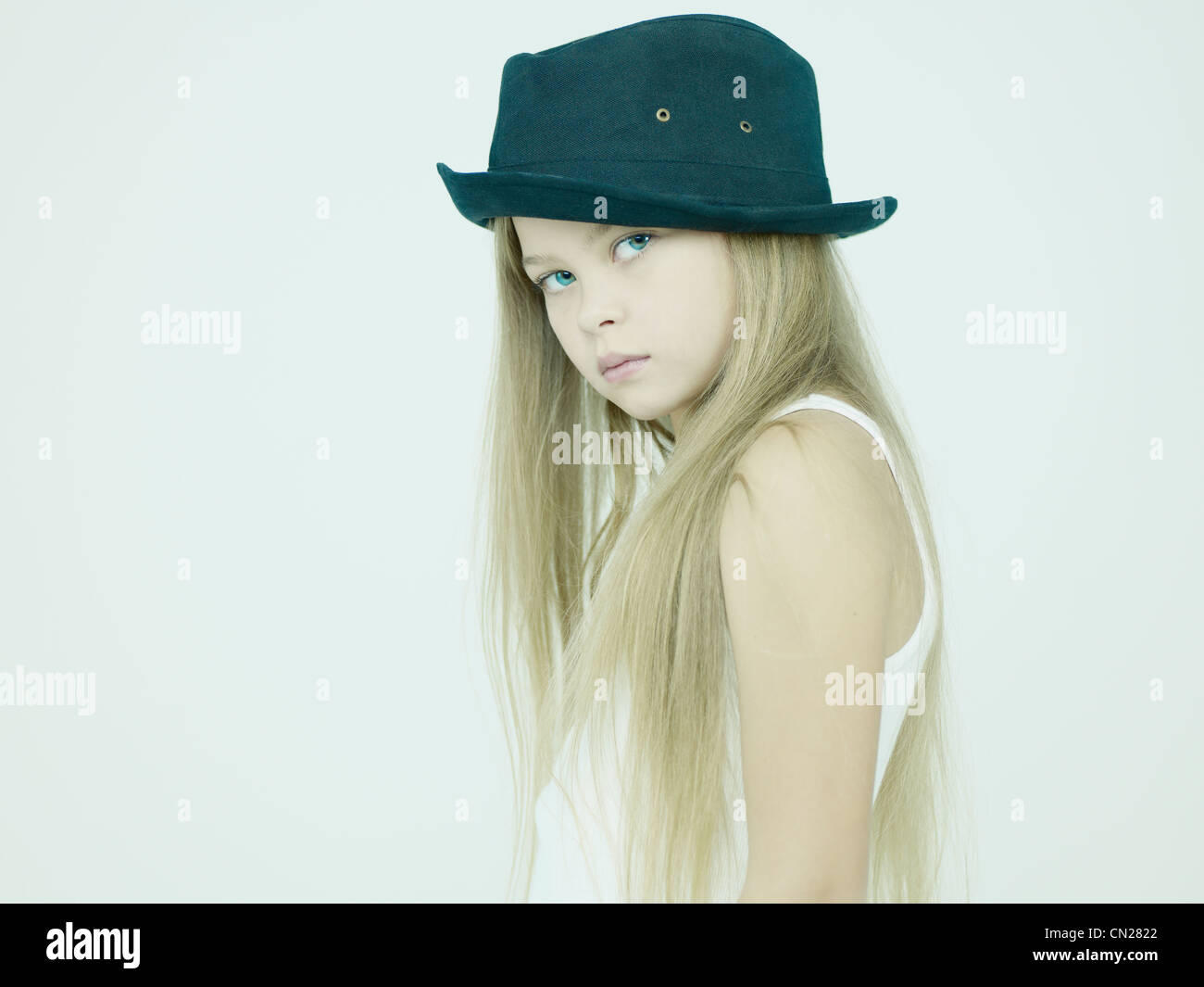 Studio portrait of beautiful little girl in hat Stock Photo - Alamy