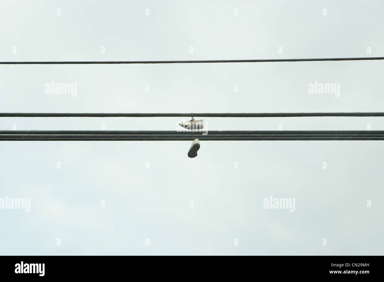 Pair of shoes on telephone line Stock Photo Alamy