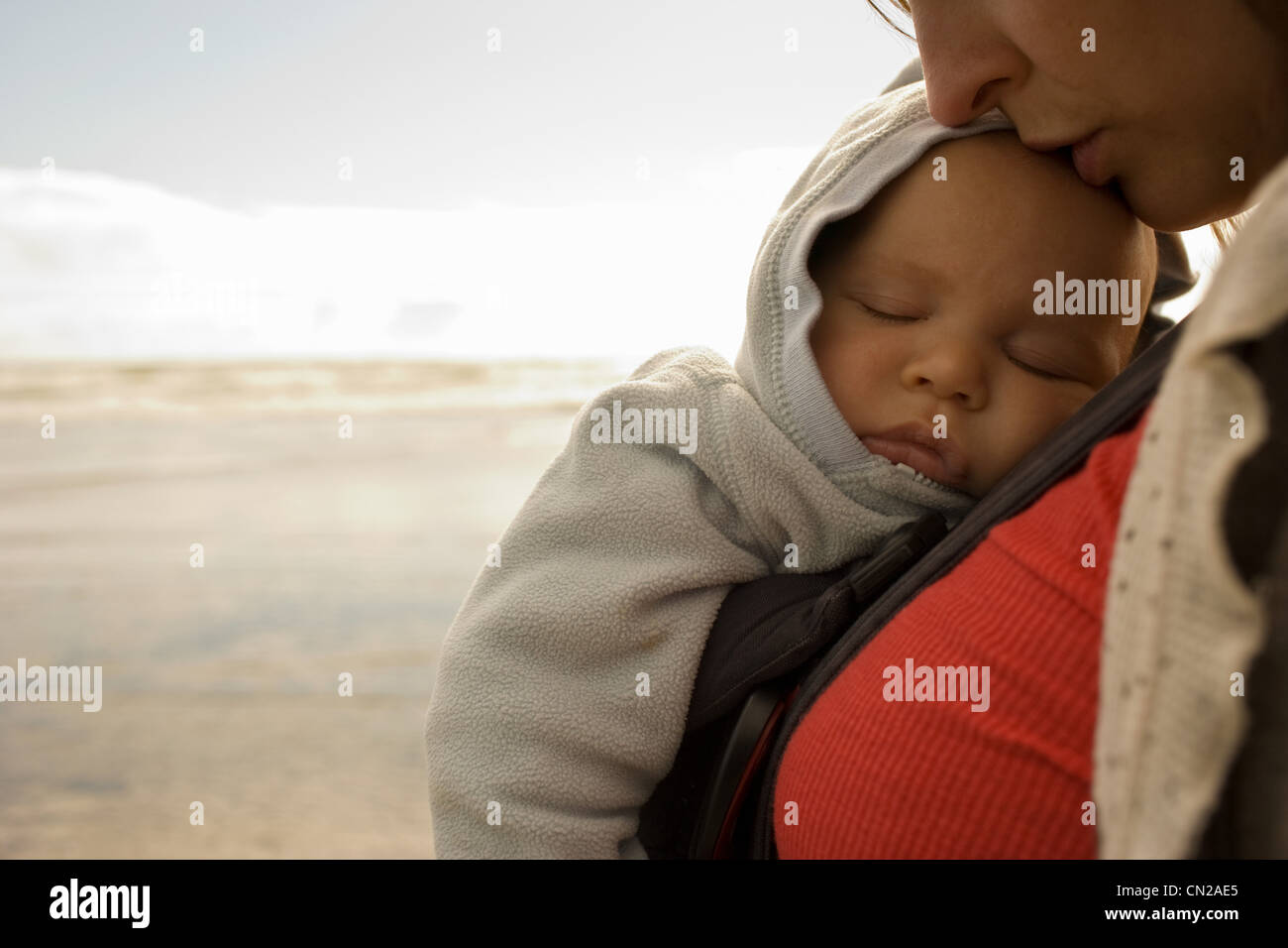 Mother with baby boy in sling Stock Photo Alamy