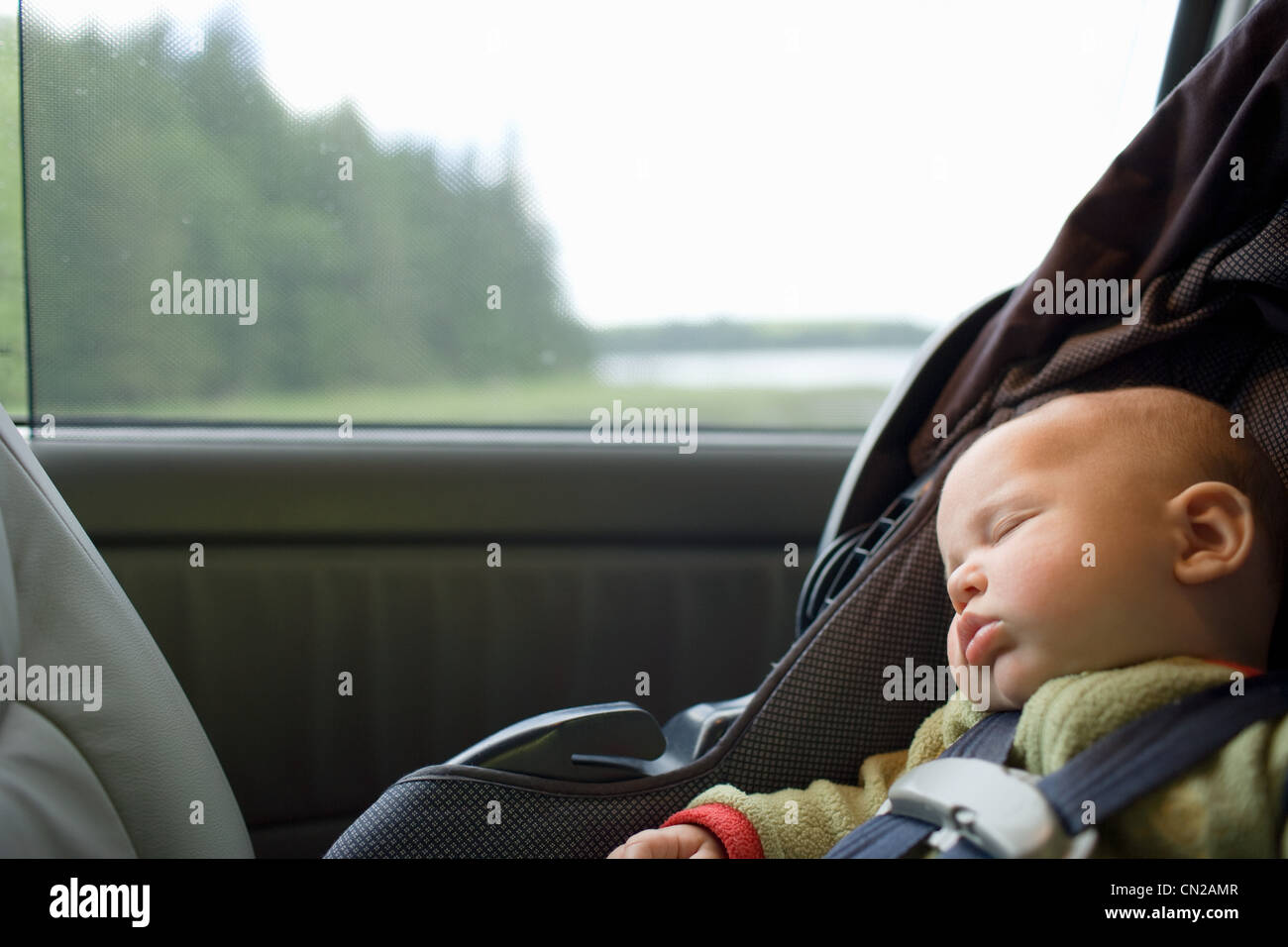 Baby boy sleeping in car seat Stock Photo Alamy