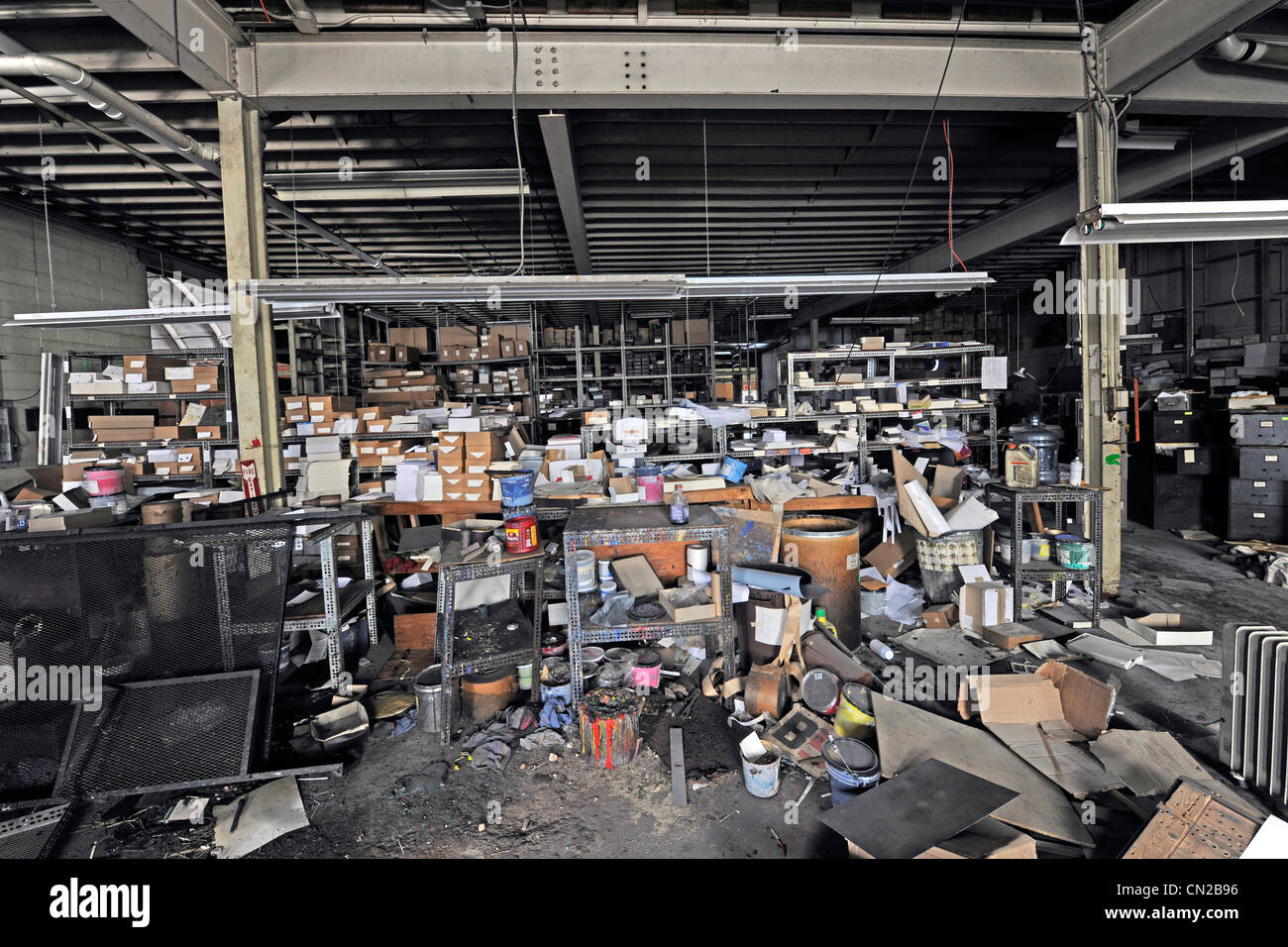 Industrial building sold in bankruptcy auction.  Unused for years, it was looted and vandalized. and occupied by squatters. Stock Photo