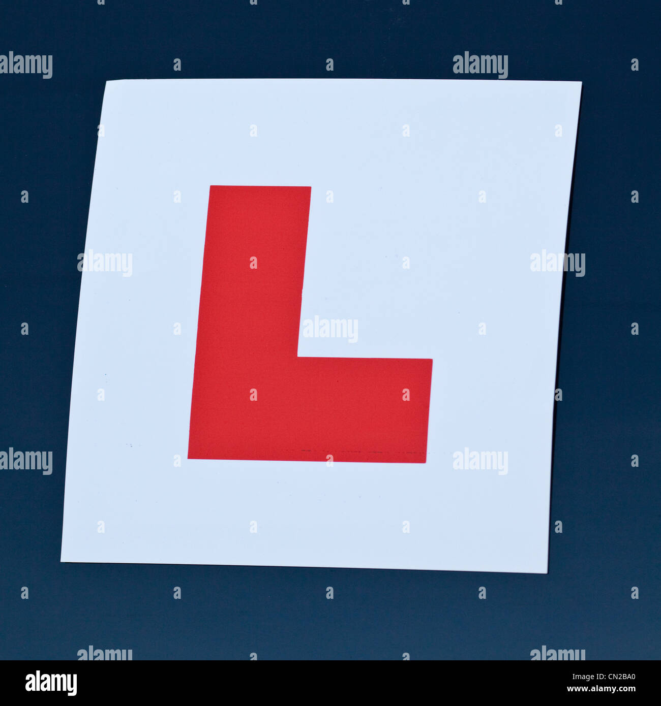 Learner driver L plate on a blue car Stock Photo