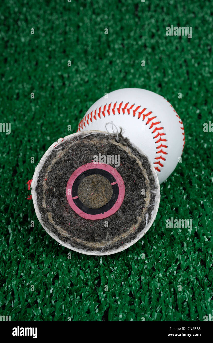 Cross section of a Rawlings Major league baseball. Has a cork center encased in two rubber layers, layers of yarn, leather cover Stock Photo