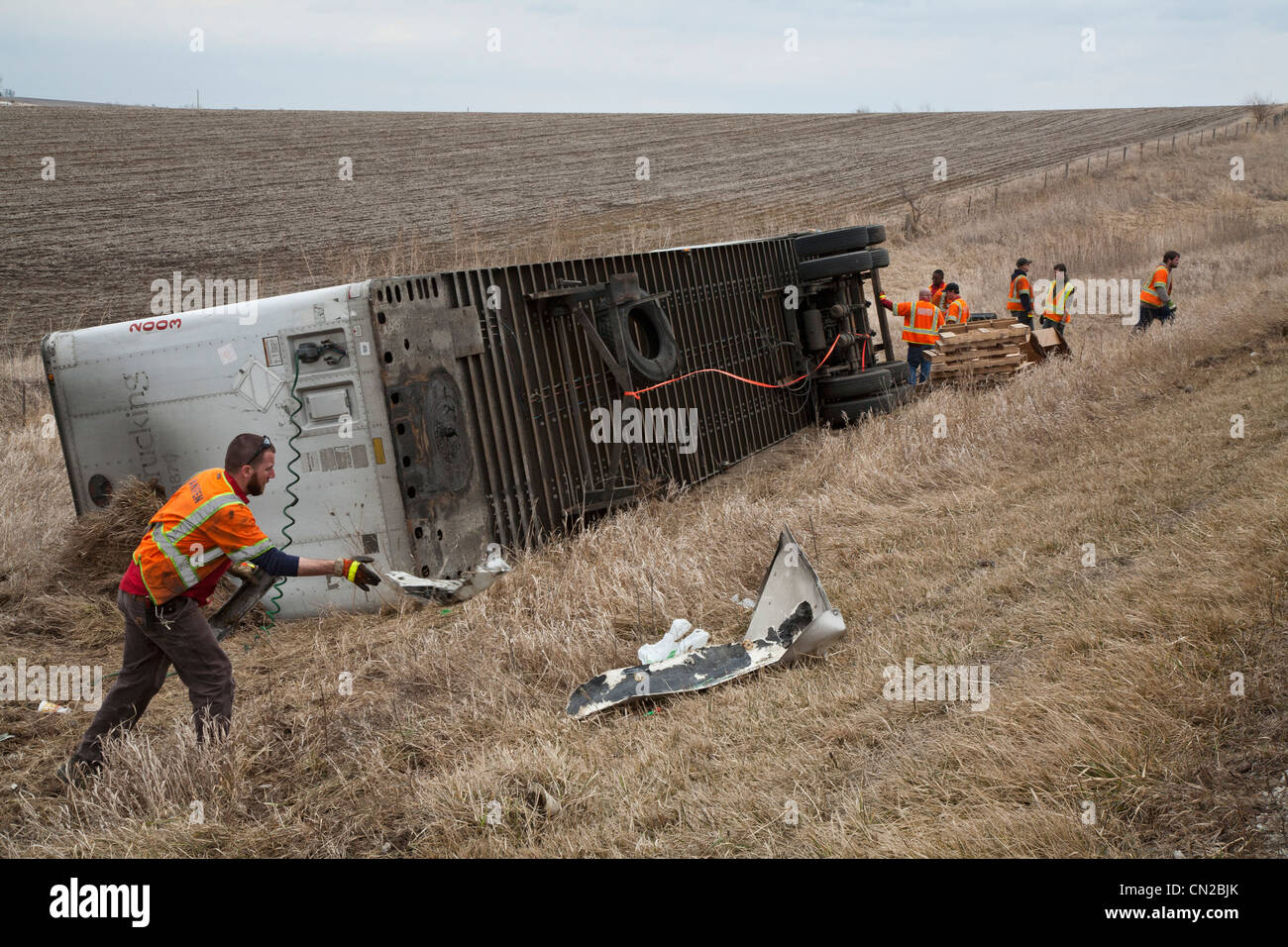 Malcolm, Iowa Salvage workers clean up a truck wreck along Interstate