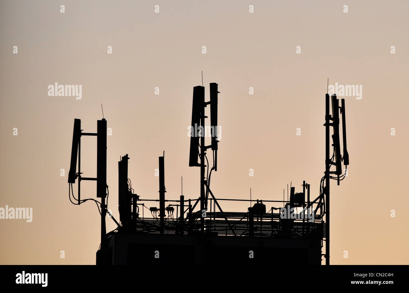 Antennas for cell phone network at sunset Stock Photo