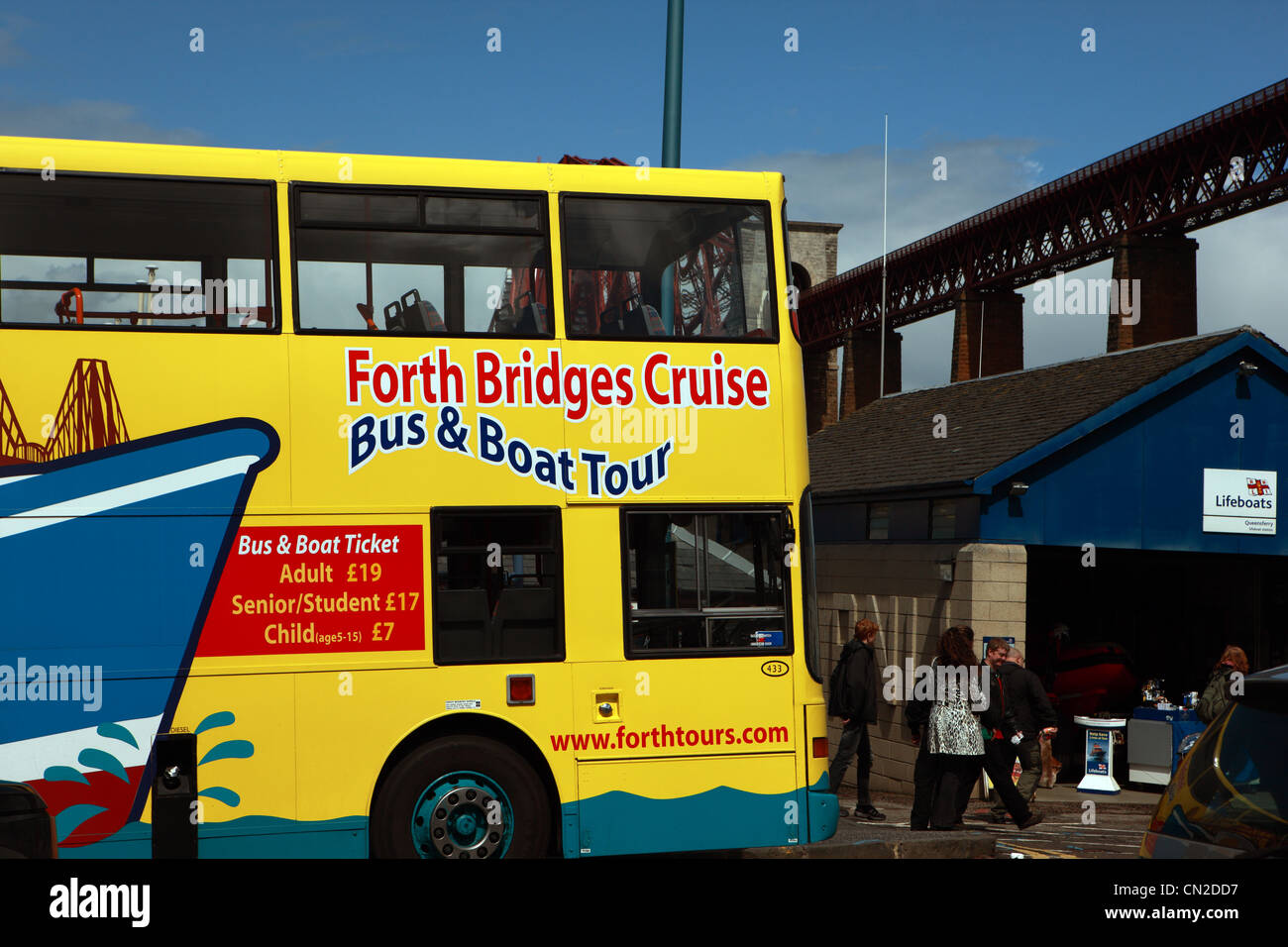 Tourist bus advertising the bus & boat trips in South Queensferry at the Forth Rail Bridge Stock Photo