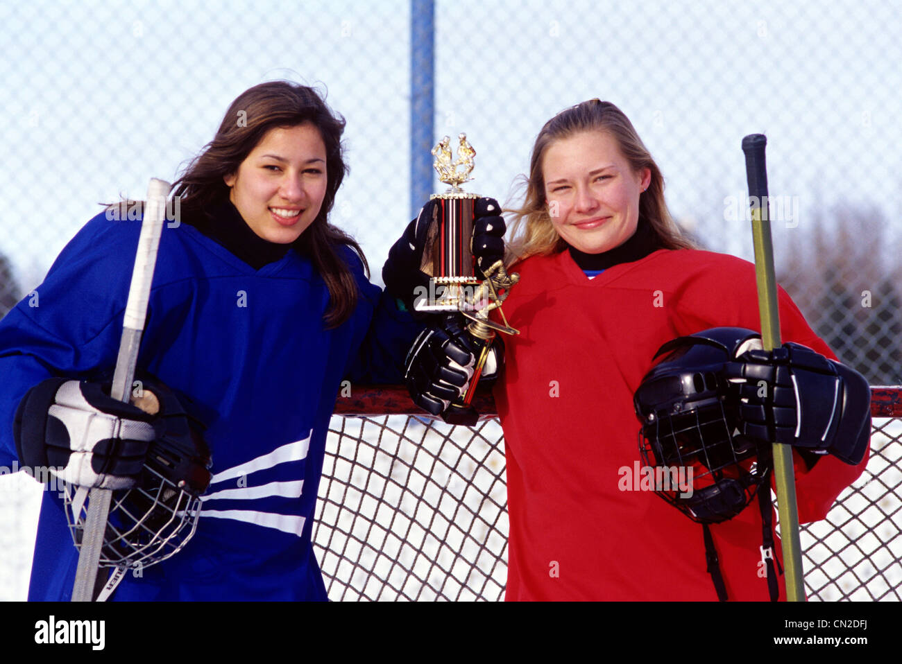 Portrait of Teenage Girl Hockey Players Holding Trophies, Winnipeg, Manitoba Stock Photo