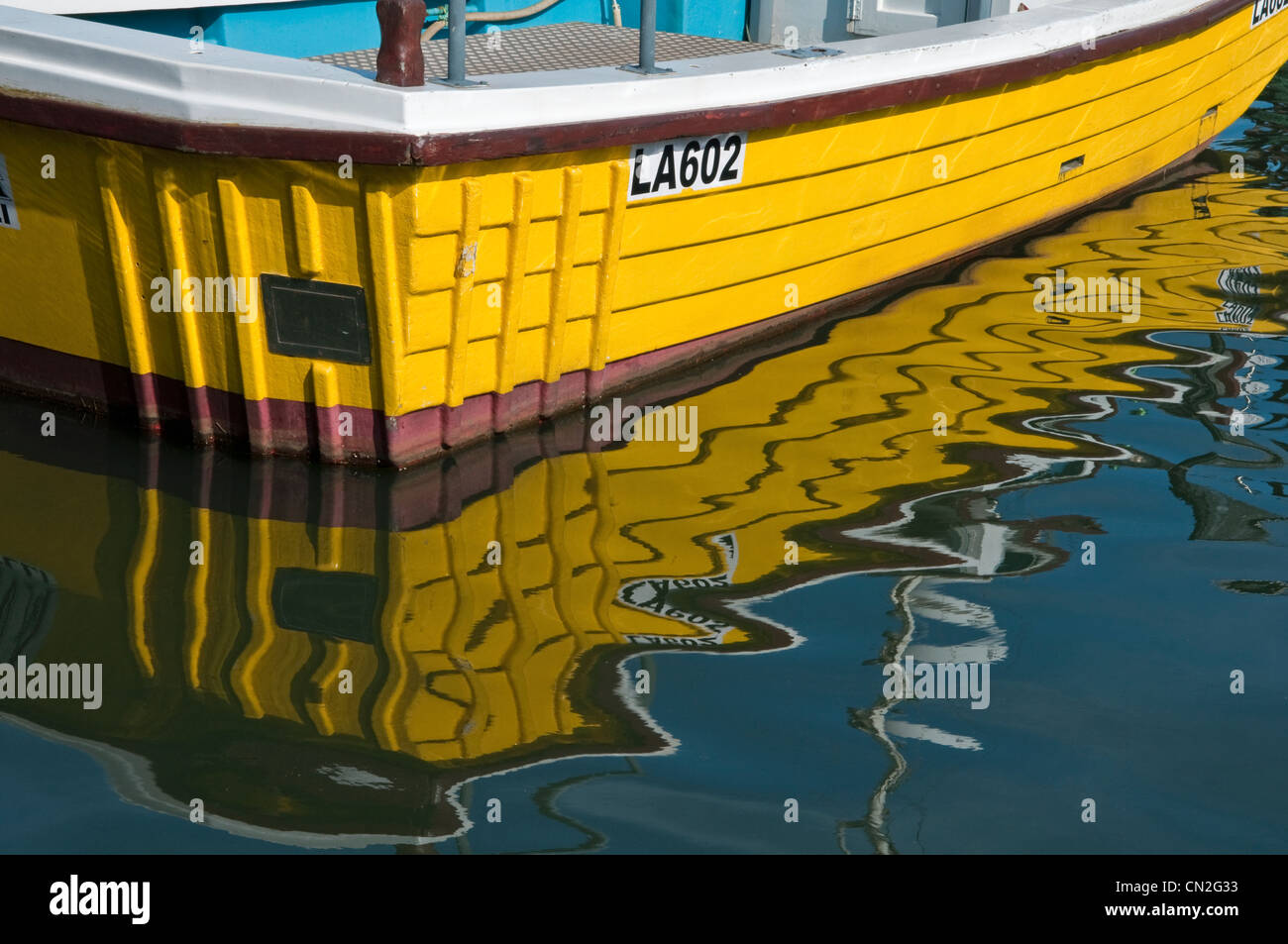 Swansea Marina (Fishing Boat Quarter) with yellow fishing boat and its reflection in foreground
