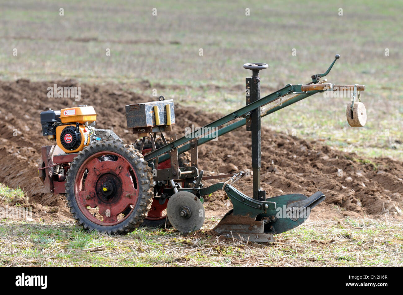 Walking tractor, Two-wheel tractor, Ploughing, plough. Stock Photo